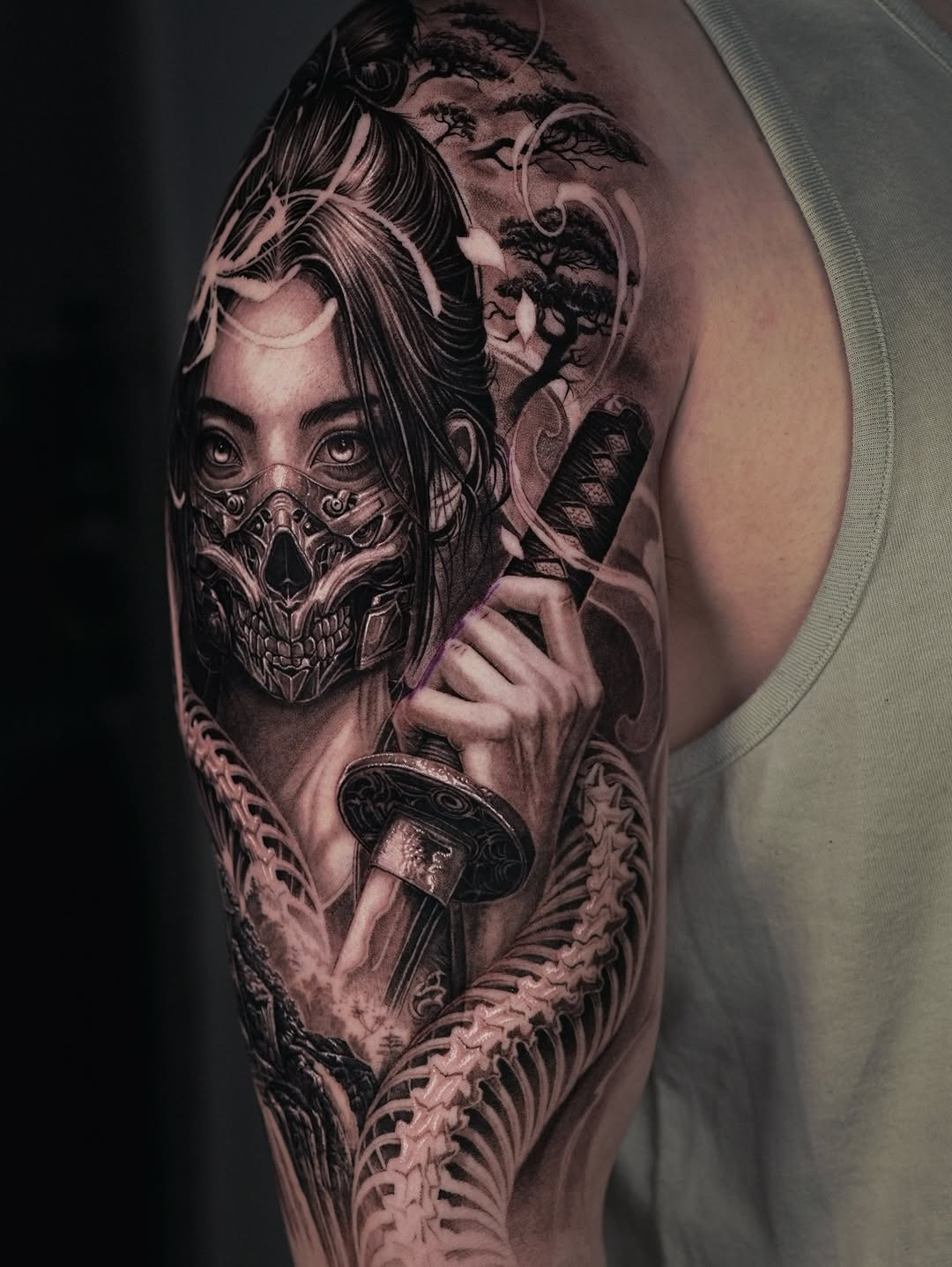Woman with mask and sword Japanese tattoo on the shoulder by Sumok Kim