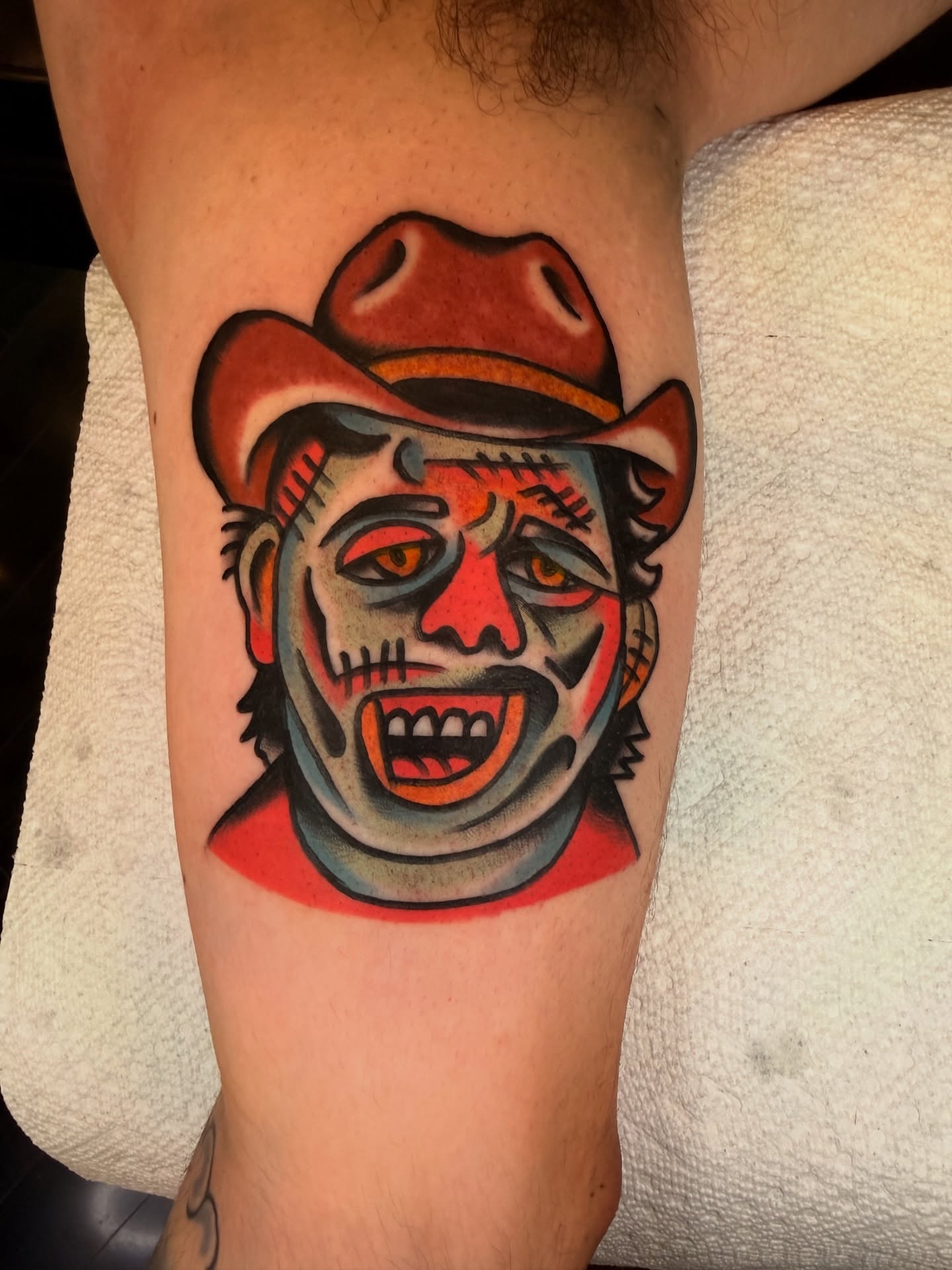 Clown American traditional tattoo on the forearm by {{Theo Glanton}}