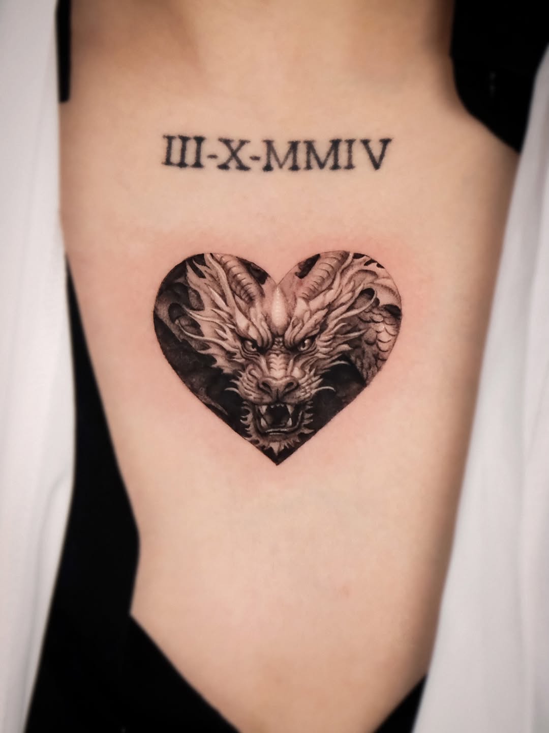 Dragon head in heart realism tattoo on the ribs by Da-An ･ﾟ✧ 다 안 𓇬˖
