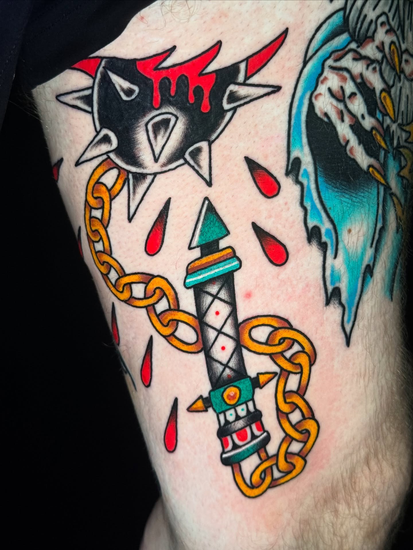 Rocket and chains American traditional tattoo on the forearm by Kenneth Gibson
