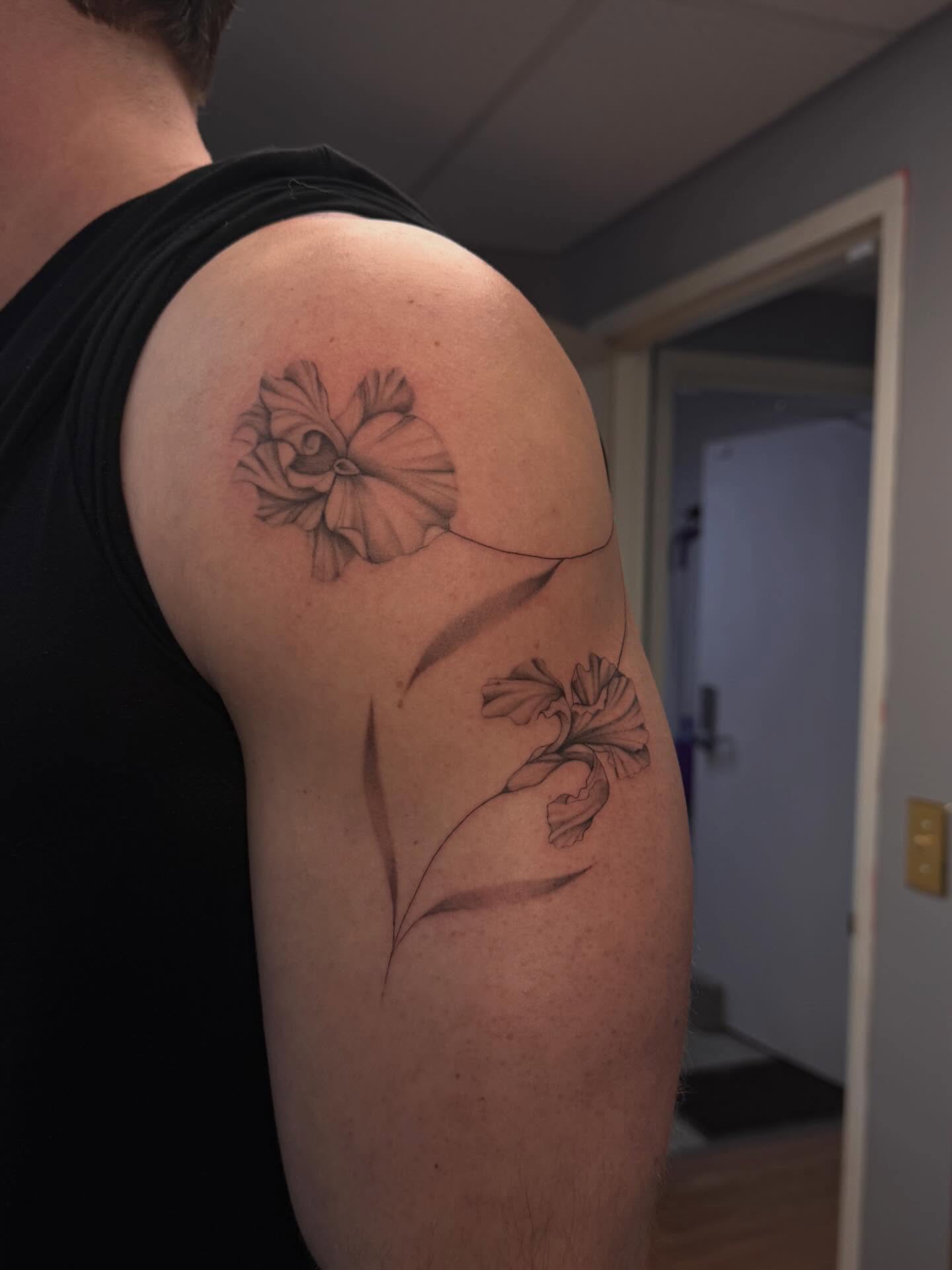 Flower black and grey tattoo on the shoulder by Anna