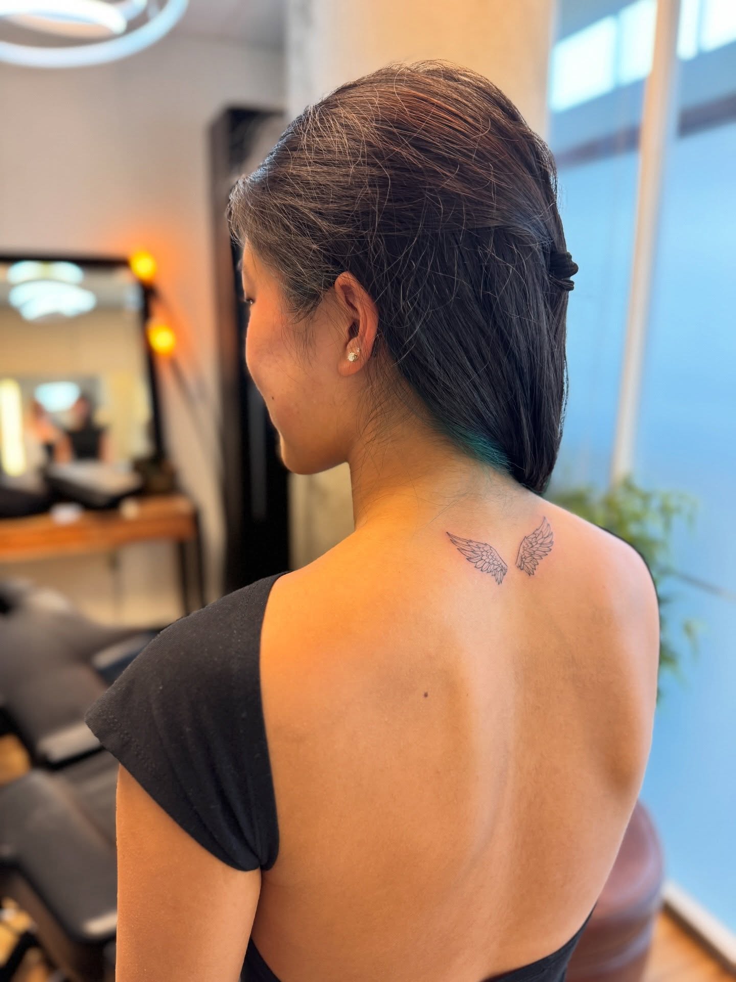 Wings black and grey tattoo on the back by Aristova Anastasia