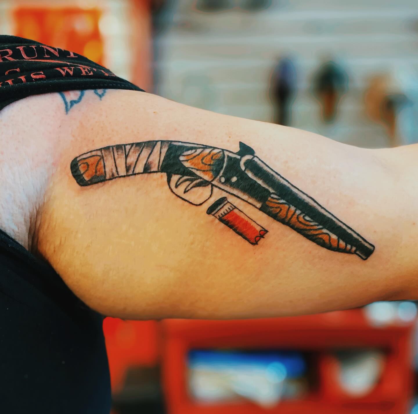 Revolver black and grey tattoo on the forearm by Tommy O'Connell