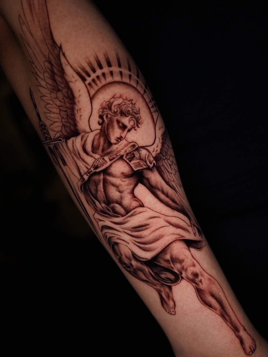 Angel with sword realism tattoo on the forearm by Jennifer Garcia
