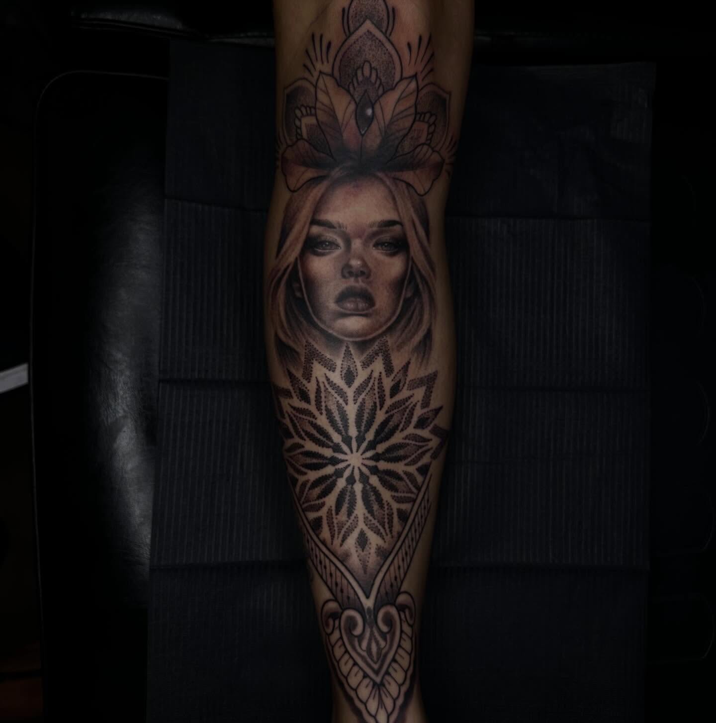 Woman's face realism tattoo on the forearm by Jay Morales