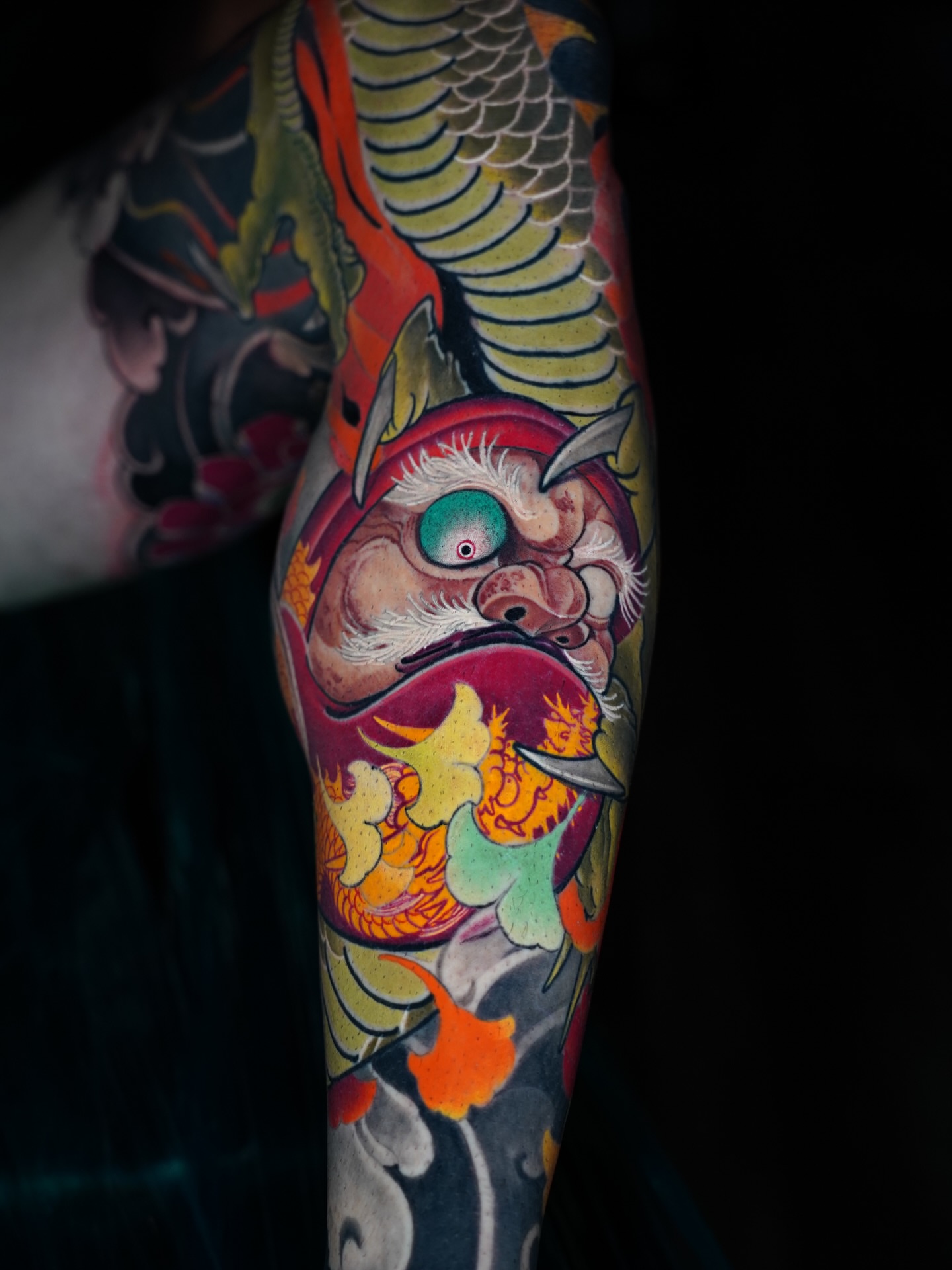 Demon with fish japanese irezumi tattoo on the forearm by Grego Hernandez, Miami, Florida