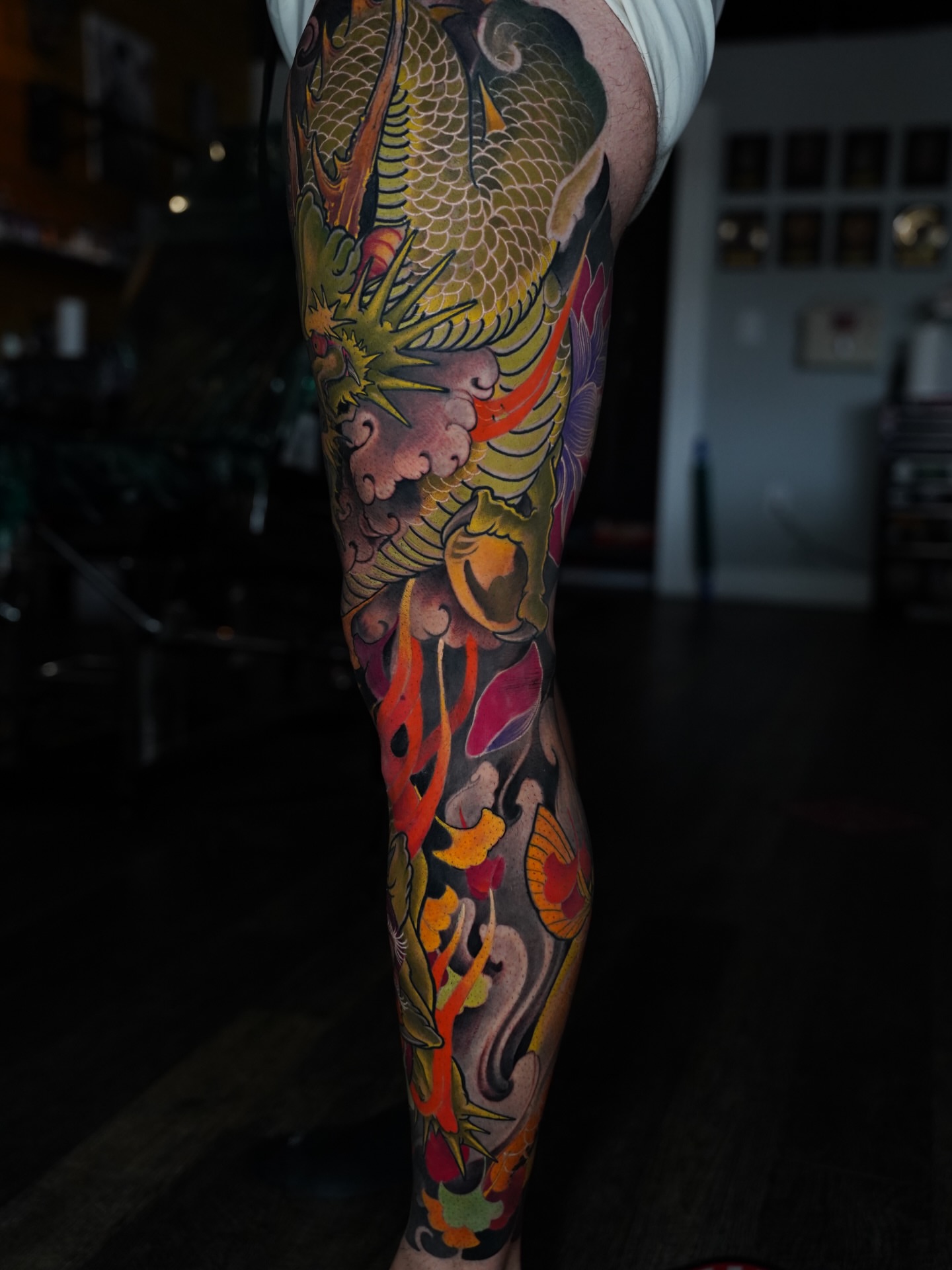 Koi fish and floral elements japanese irezumi tattoo on the forearm by Grego Hernandez, Miami, Florida