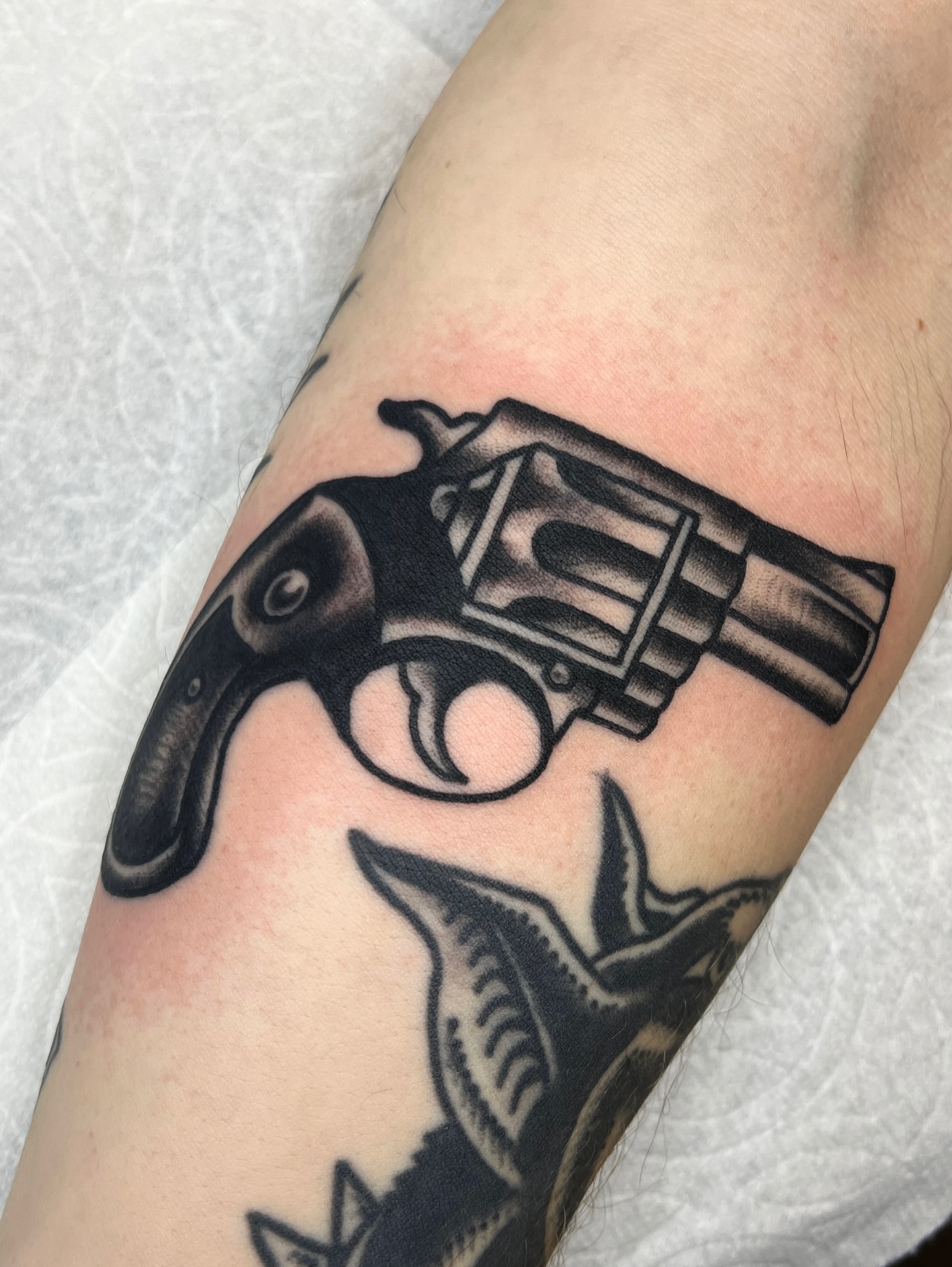 Revolver black and grey tattoo on the forearm by Leo 🌞 Pdx Tattoo