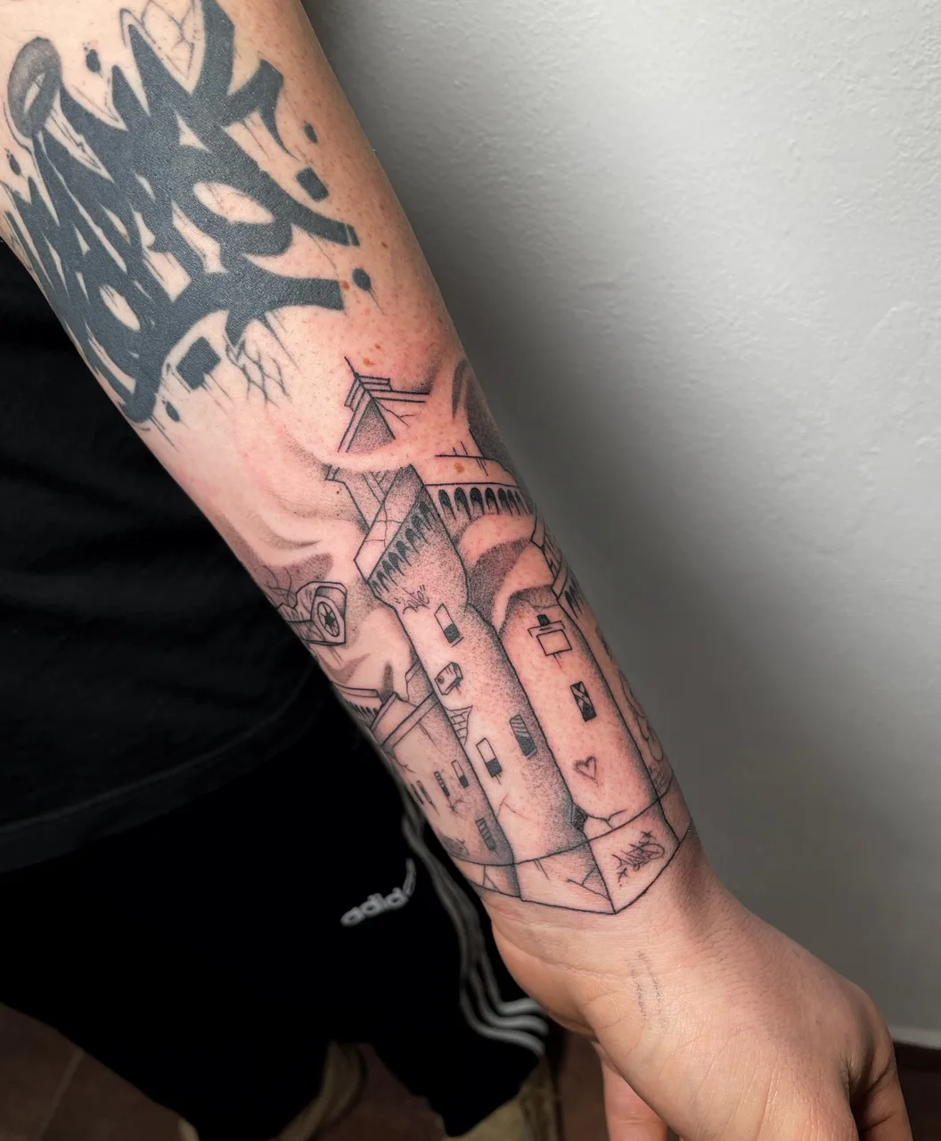 Castle black and grey tattoo on the forearm by Blot_Tattoo