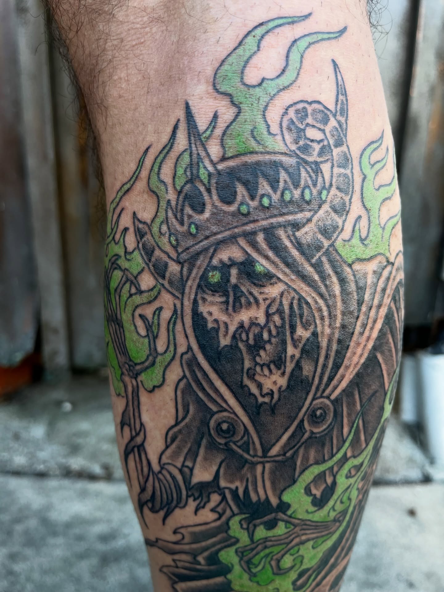 Skull and crown dark realism tattoo on the leg by Campbell Zane Alexander