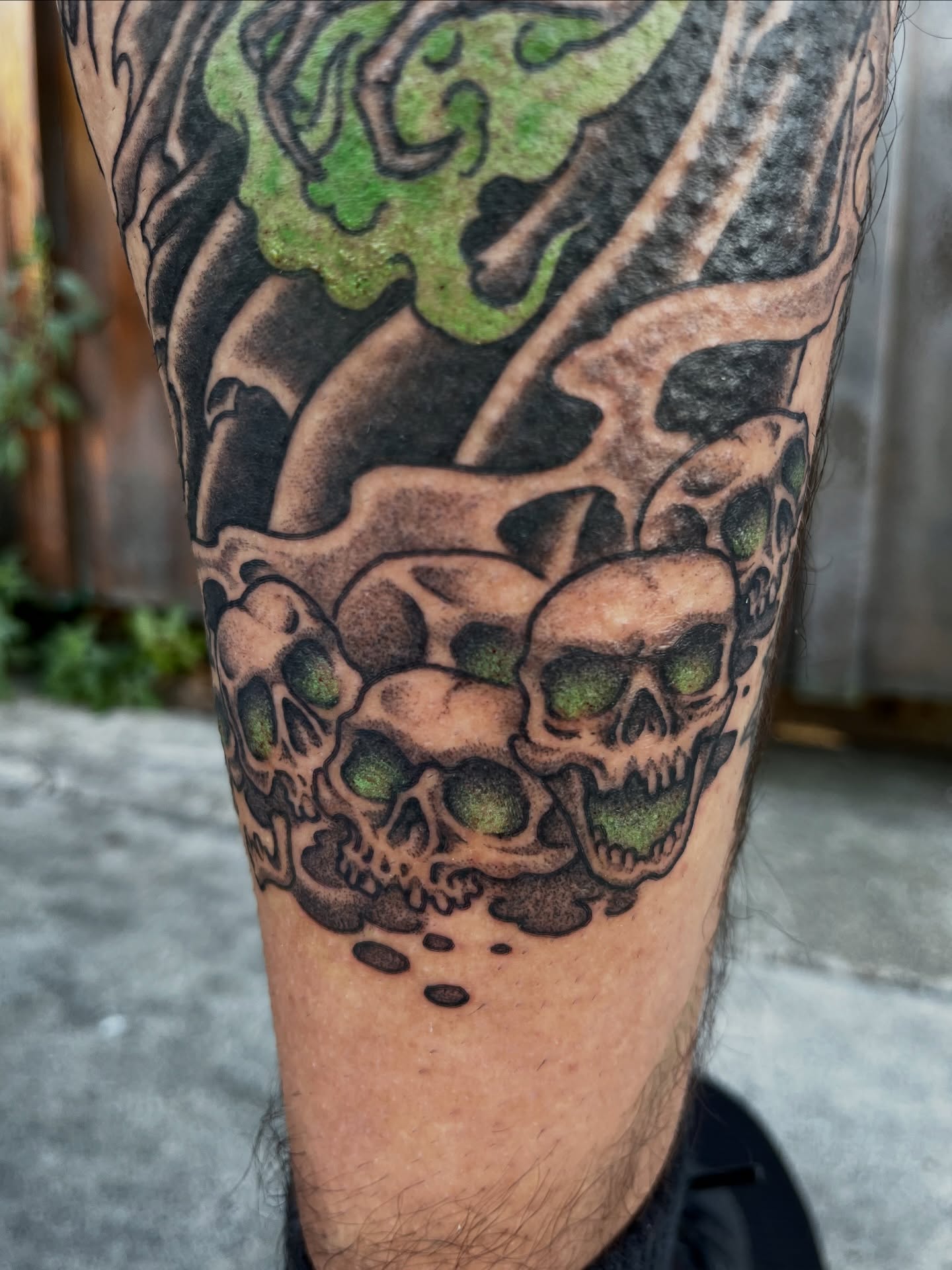 Skulls and flames neo-traditional tattoo on the forearm by Campbell Zane Alexander