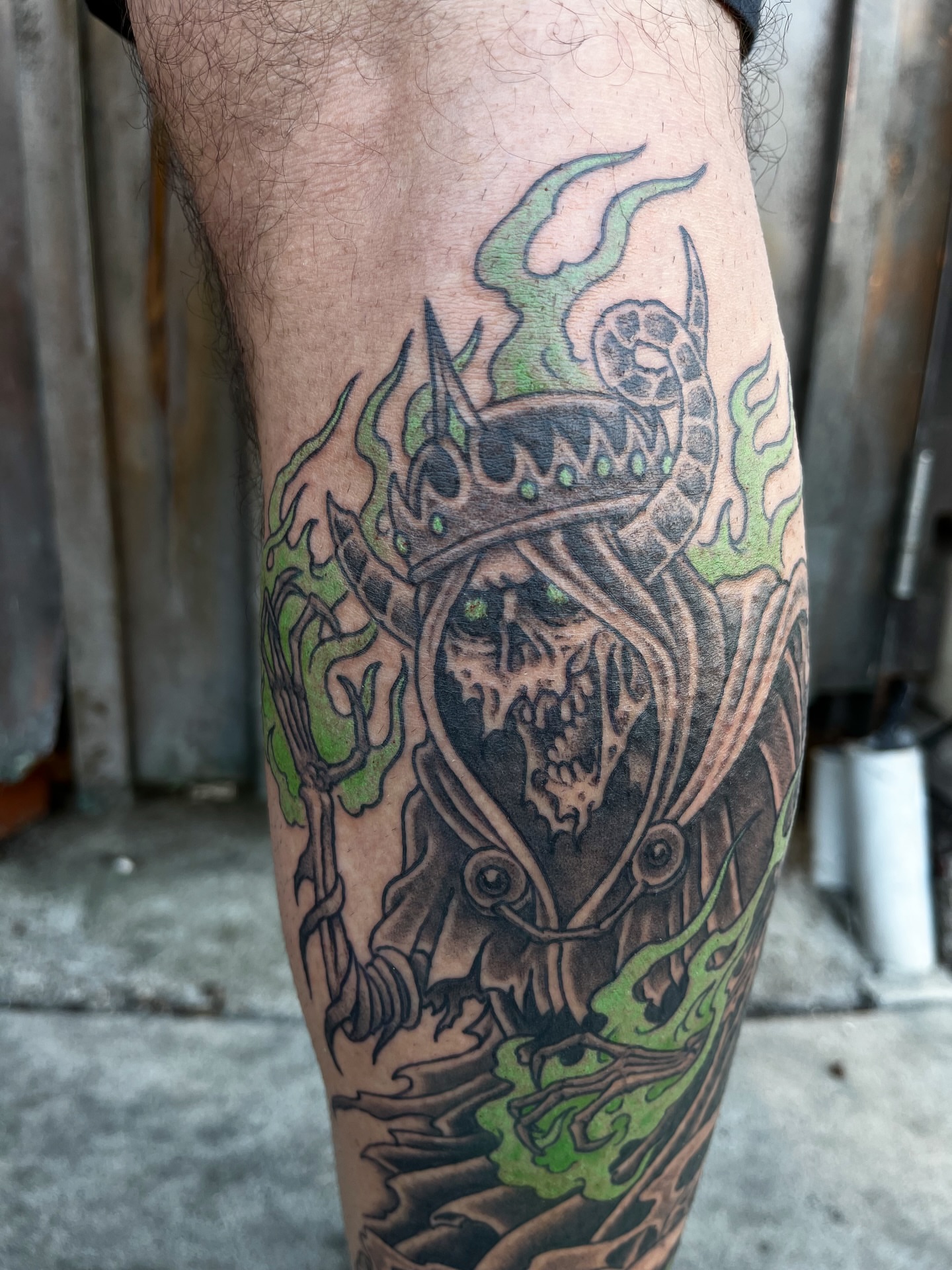 Skull with crown dark realism tattoo on the forearm by Campbell Zane Alexander