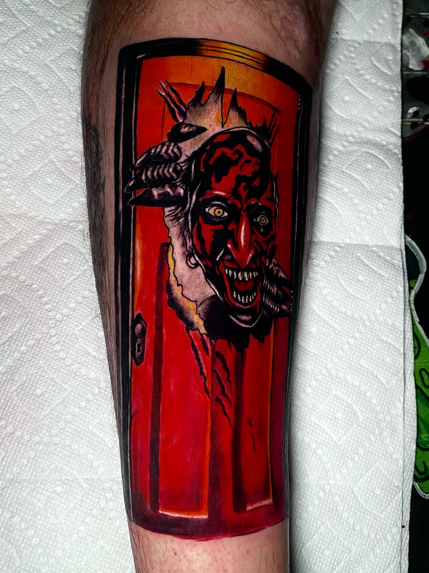 Demon dark realism tattoo on the calf by Randi Frey