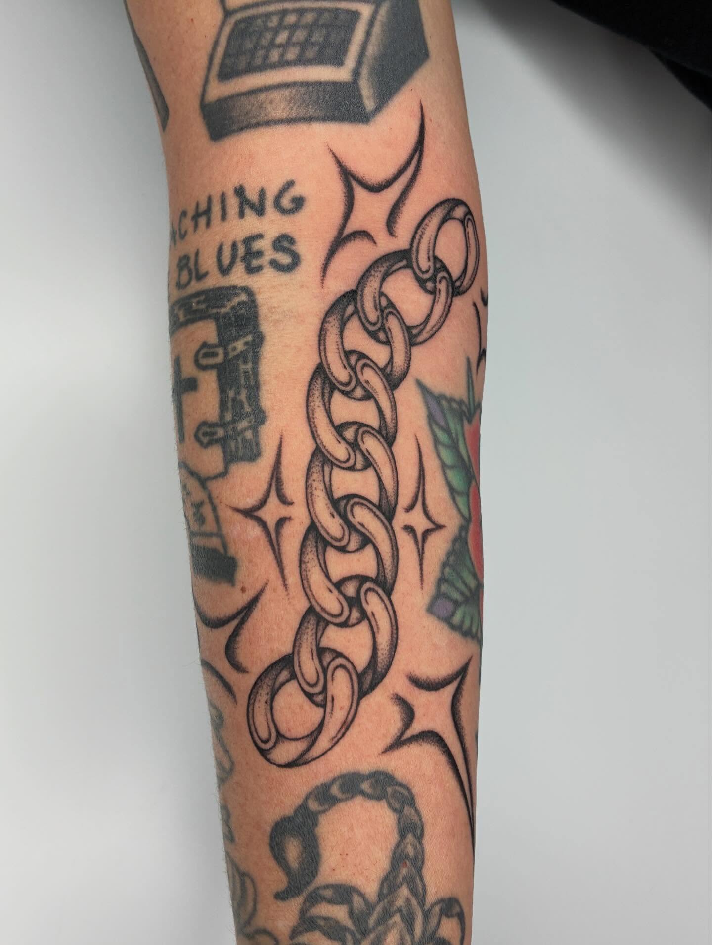 Chain American traditional tattoo on the forearm by Steven Sessler, San Francisco, California