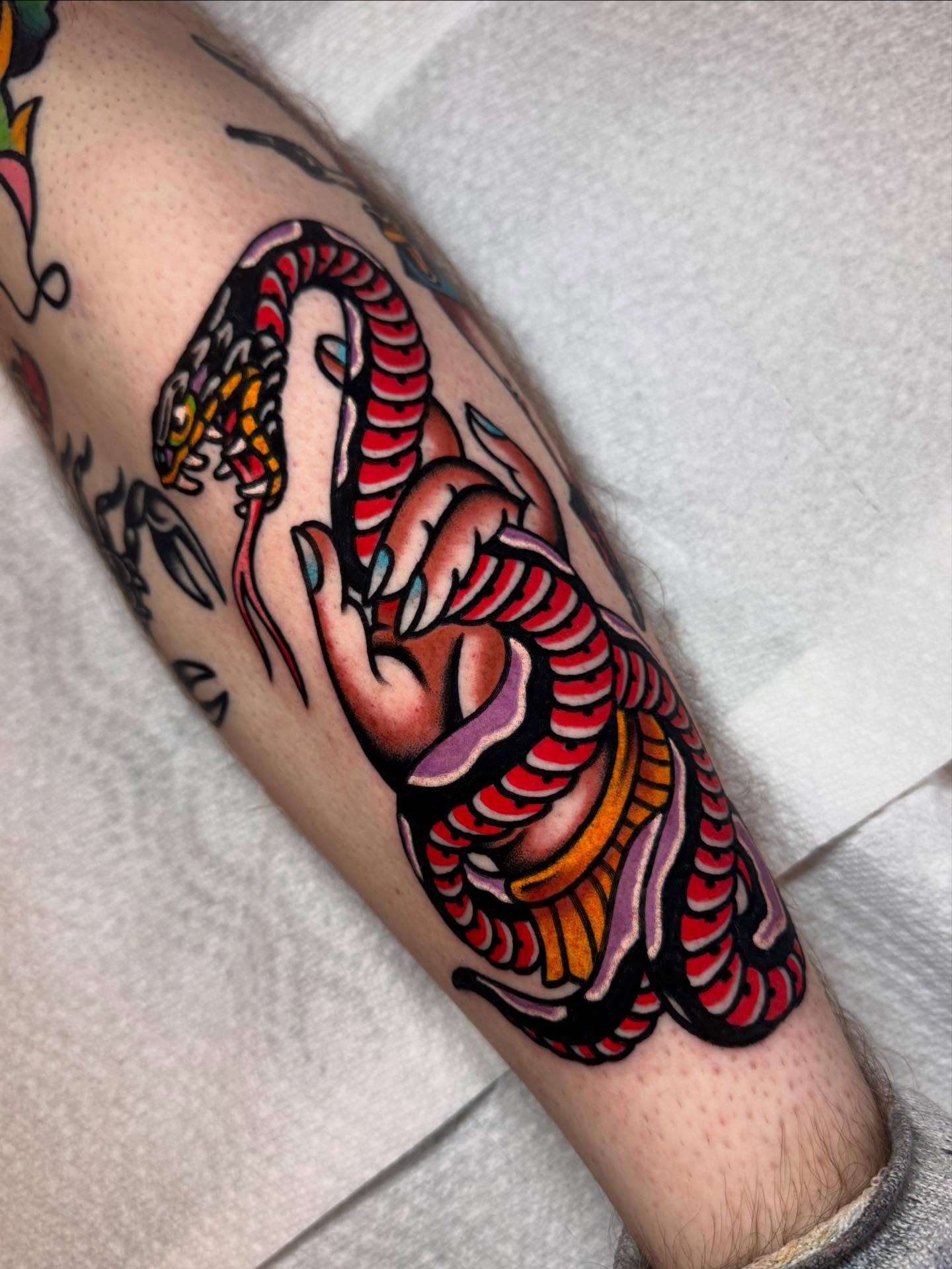 Snake American traditional tattoo on the forearm by Jonathan Clapp, San Antonio, Texas