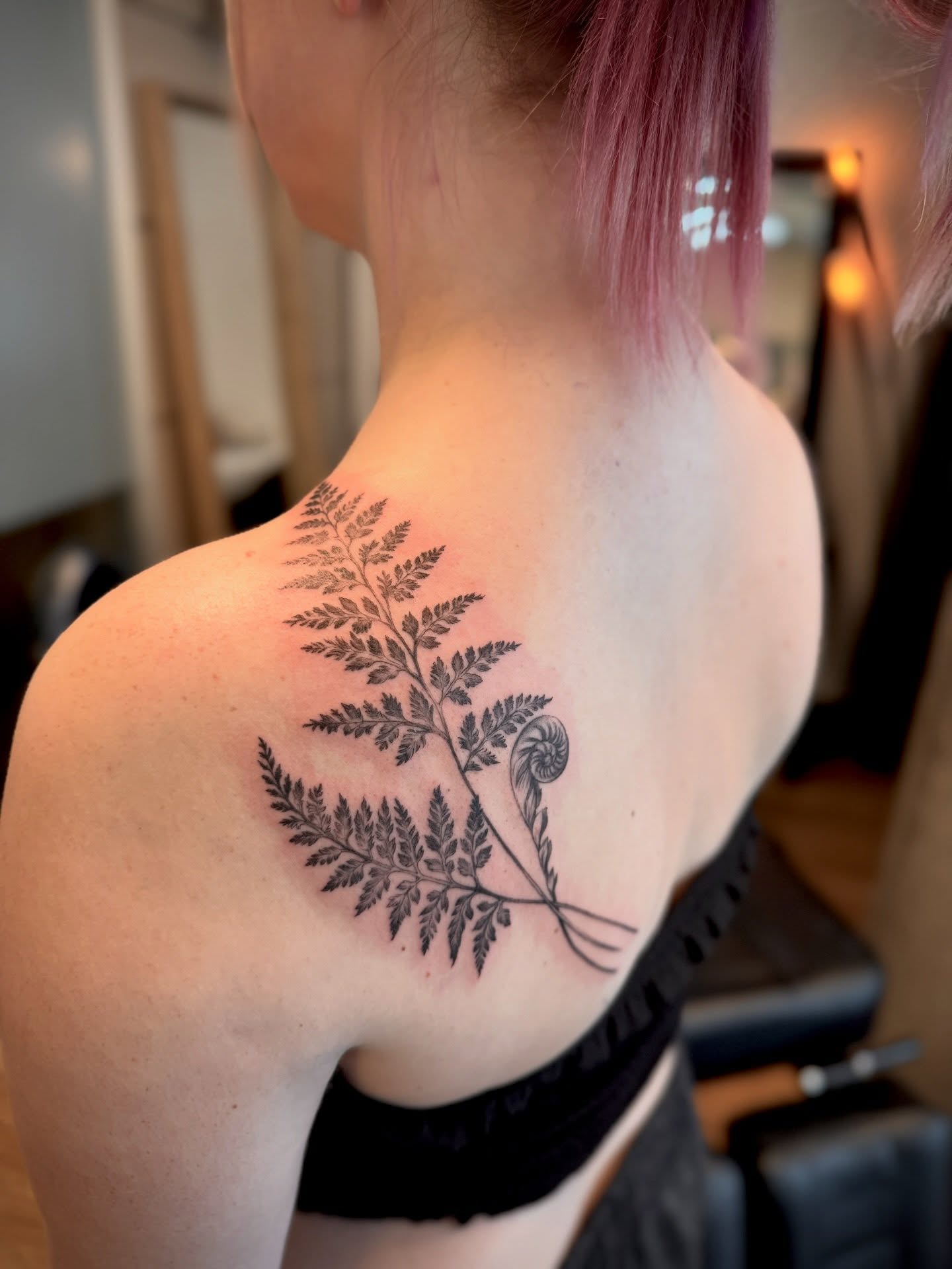 Fern black and grey tattoo on the shoulder by Aristova Anastasia