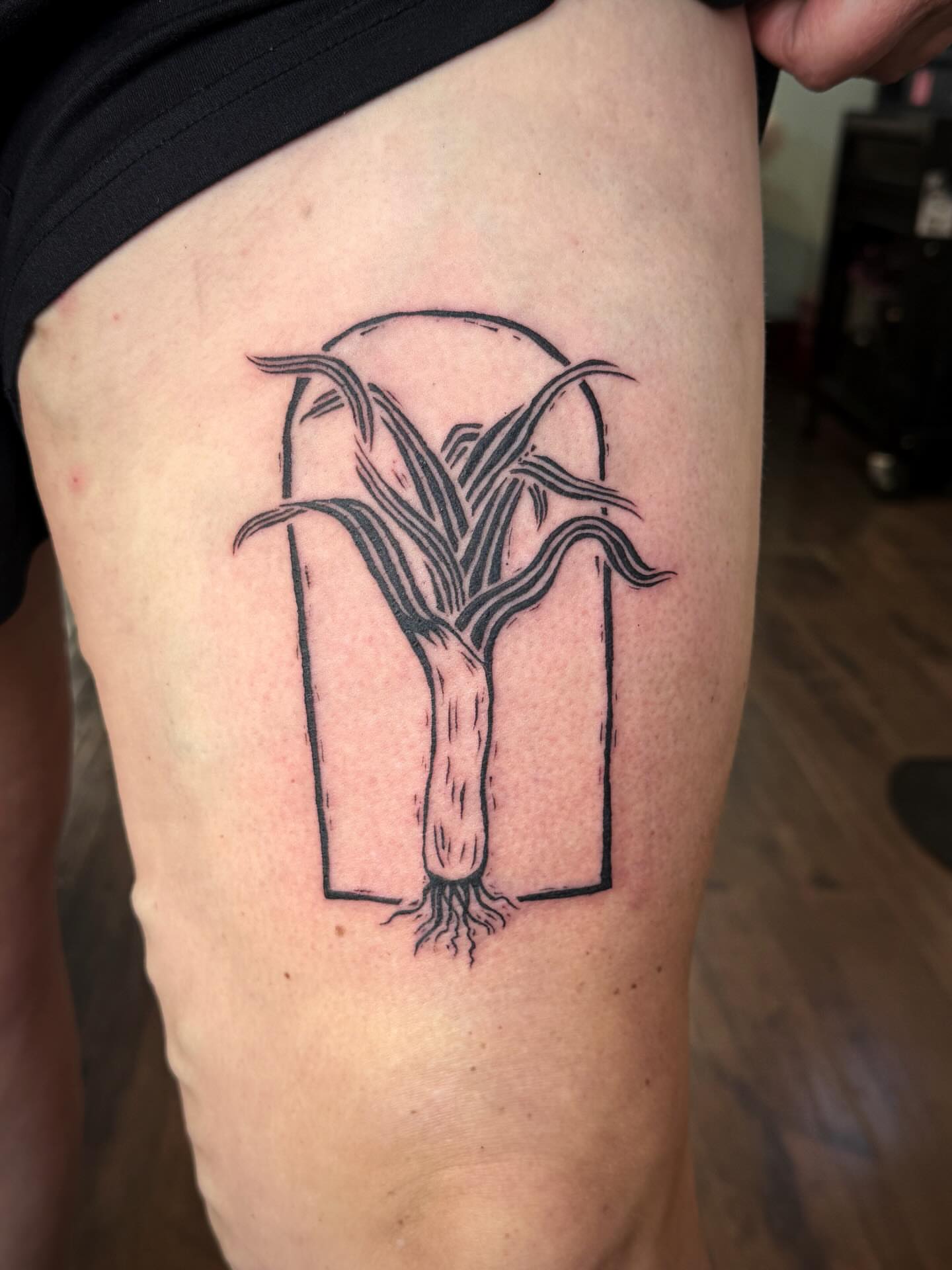 Leek black and grey tattoo on the thigh by Luna Enriquez⚡️, Portland, Oregon