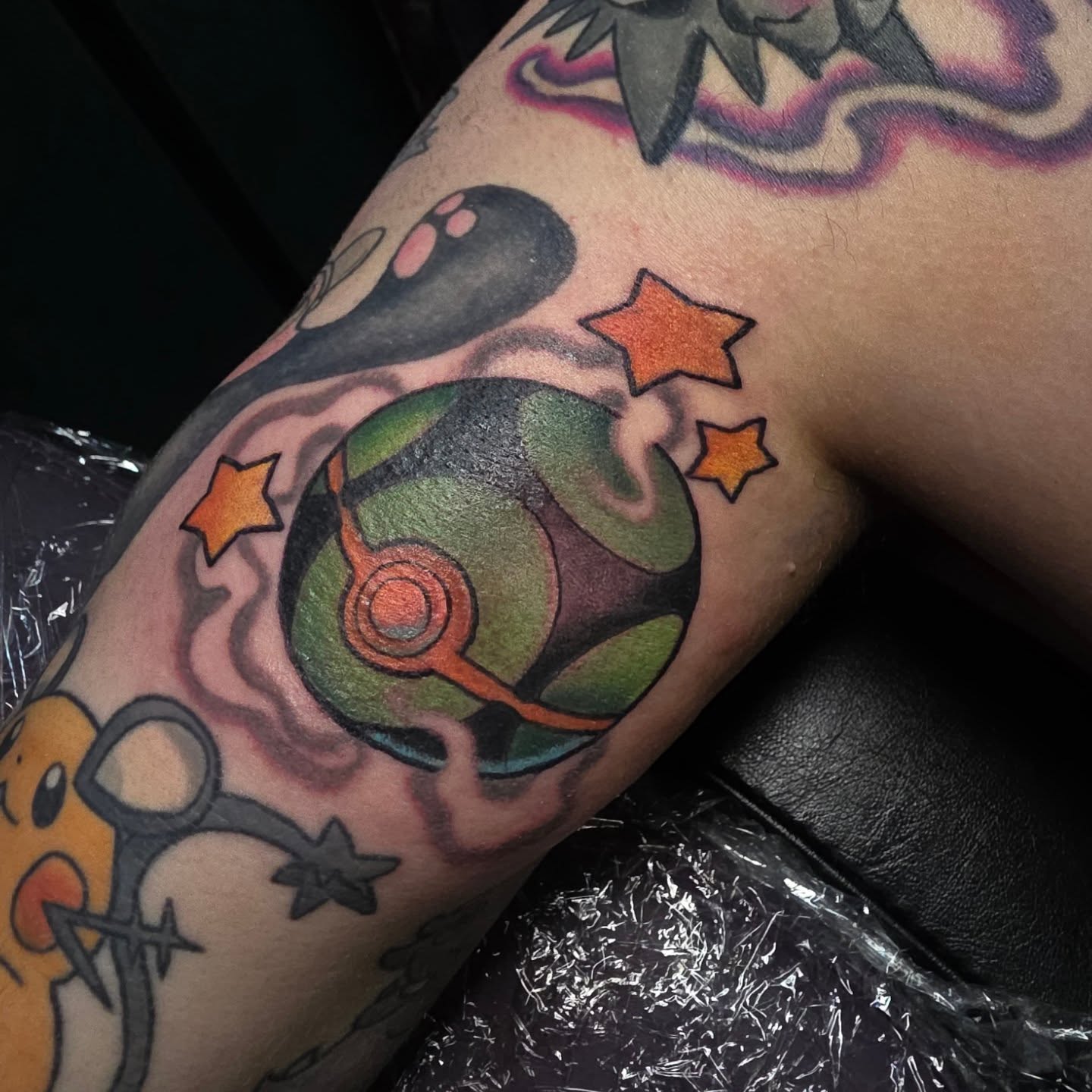 Pokémon Poké Ball new school tattoo on the forearm by Kayla Williams