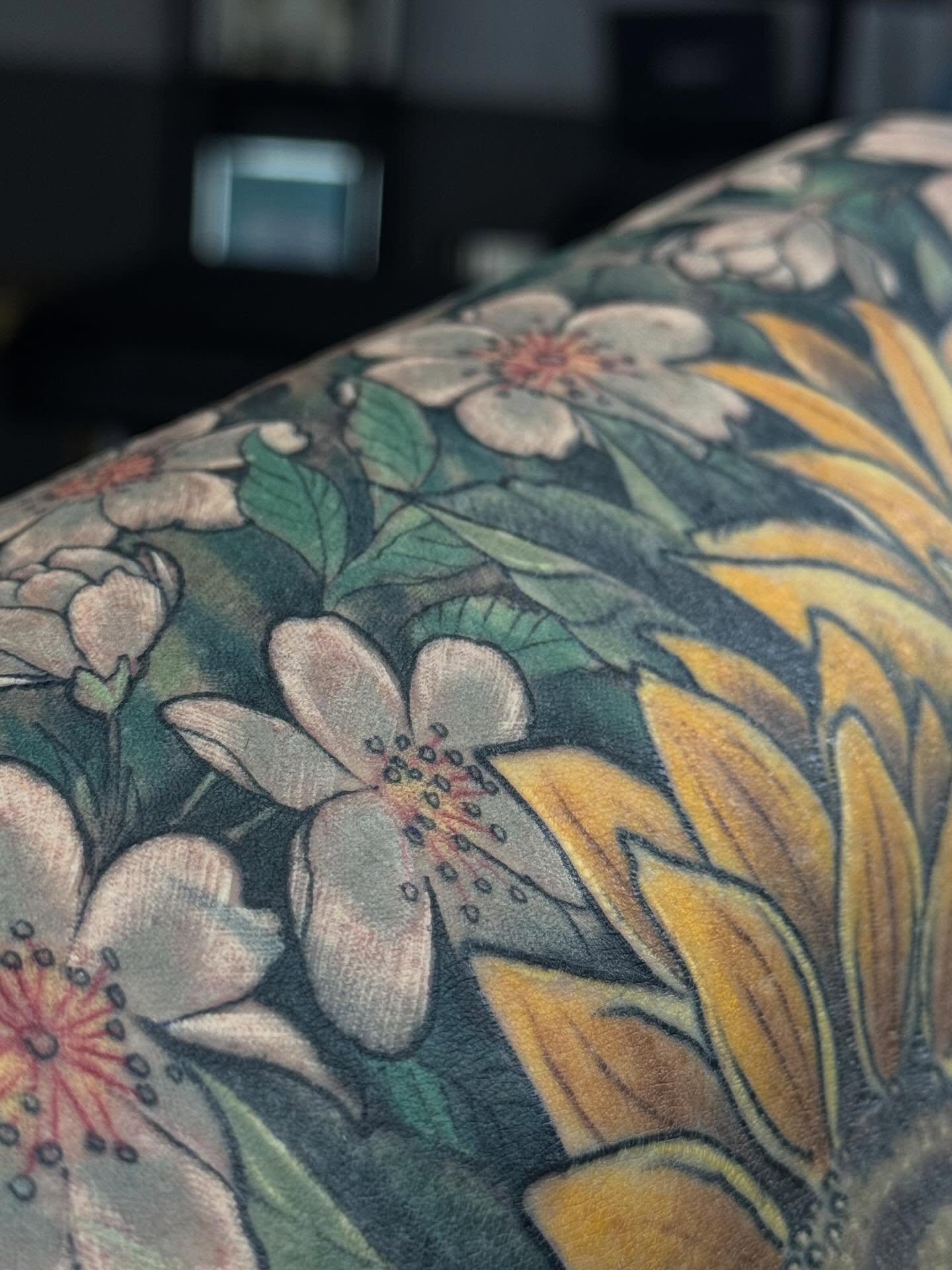 Floral arrangement realism tattoo on the upper arm by jonhighland
