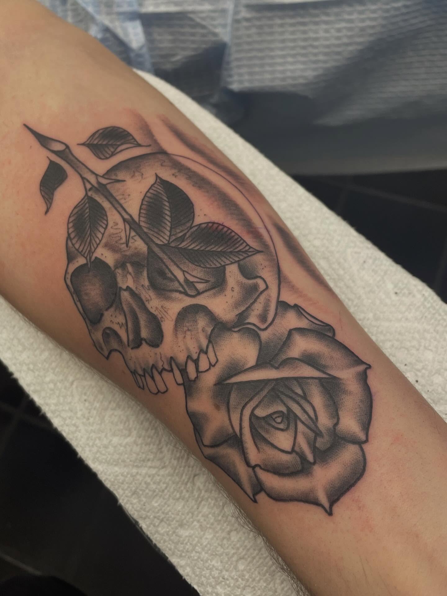 Skull and rose realism tattoo on the forearm by Andres Patino 🇪🇨🇺🇸