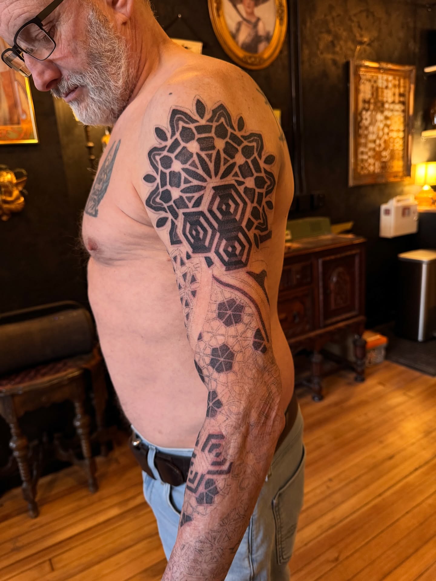 Geometric pattern geometric tattoo on the upper arm by Christofer Irvin