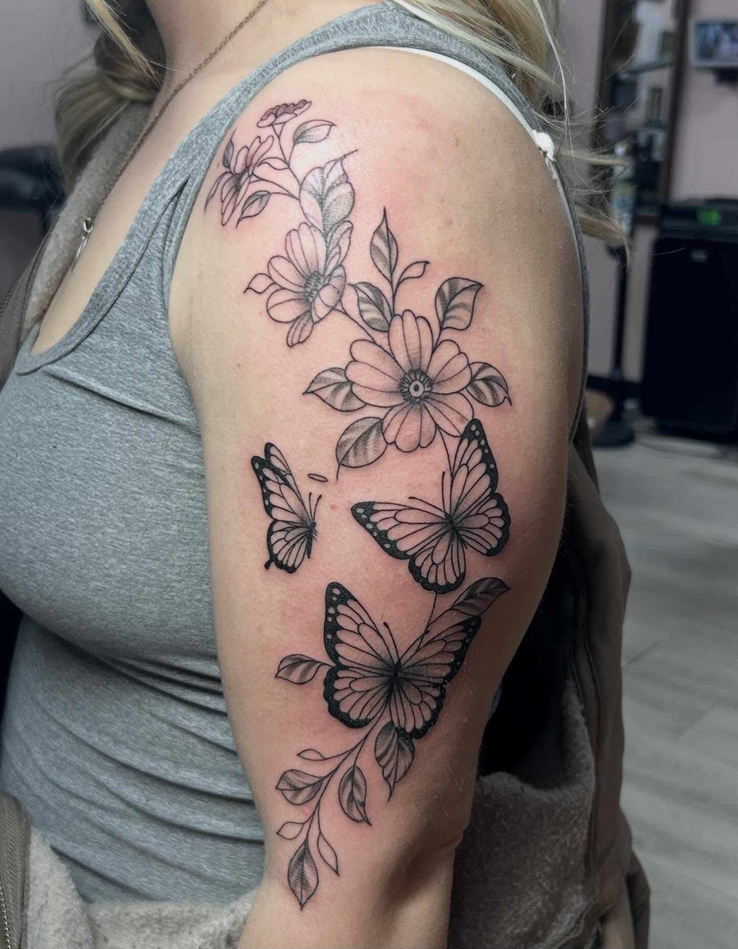 Flowers and butterflies black and grey tattoo on the shoulder by Red✨, Gansevoort, New York
