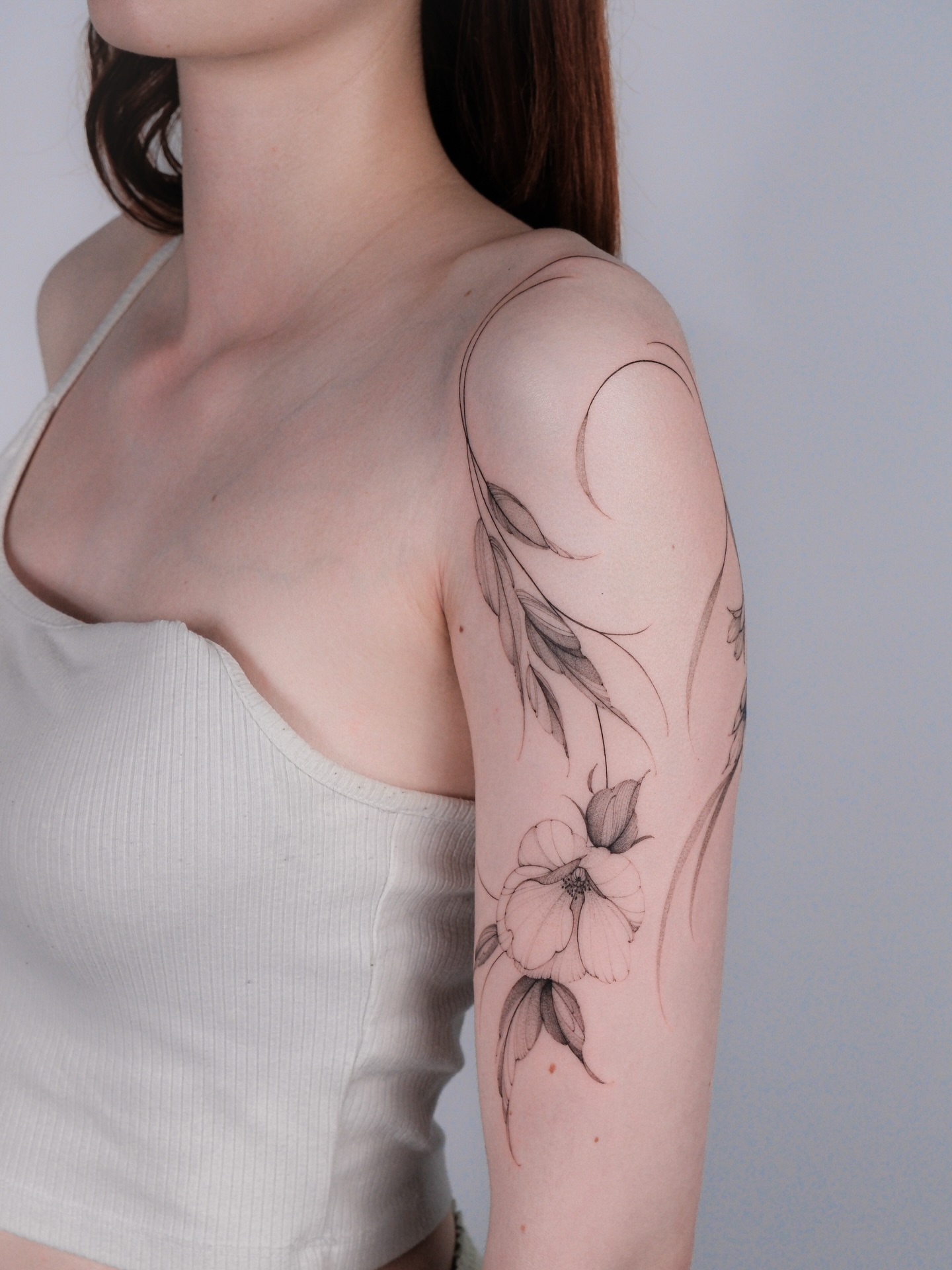 Flower black and grey tattoo on the upper arm by i flower you