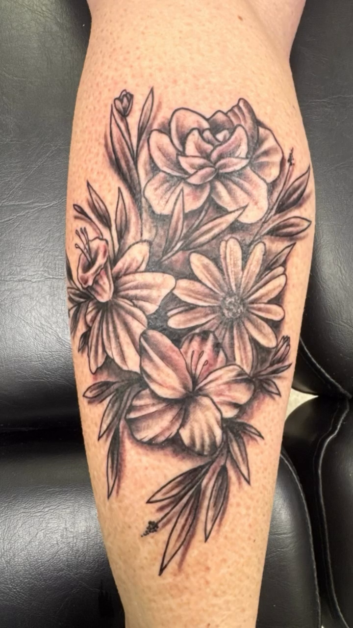 Floral arrangement realism tattoo by Chris Allen Taylor