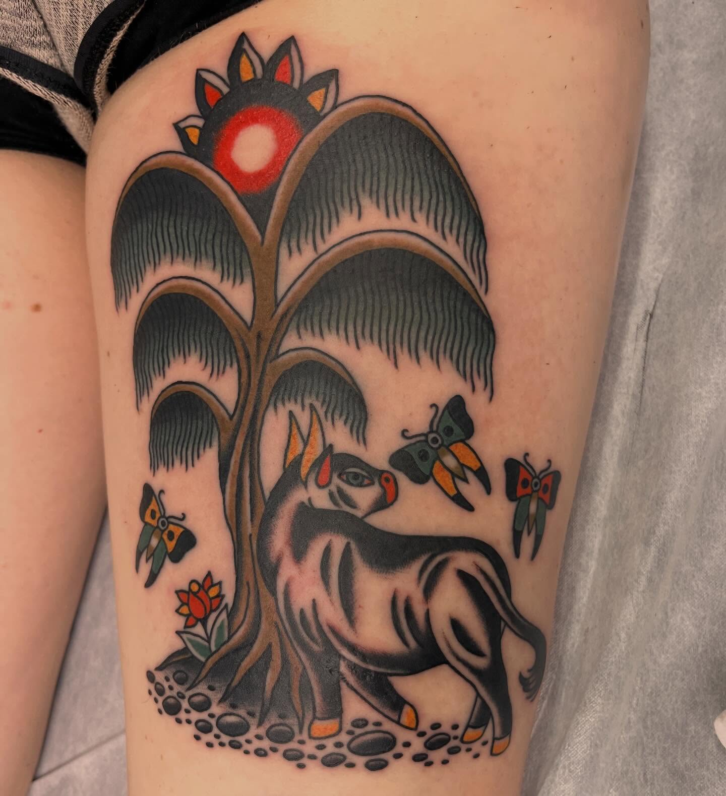 Deer under tree American traditional tattoo on the thigh by Nicole💀, Salt Lake City, Utah