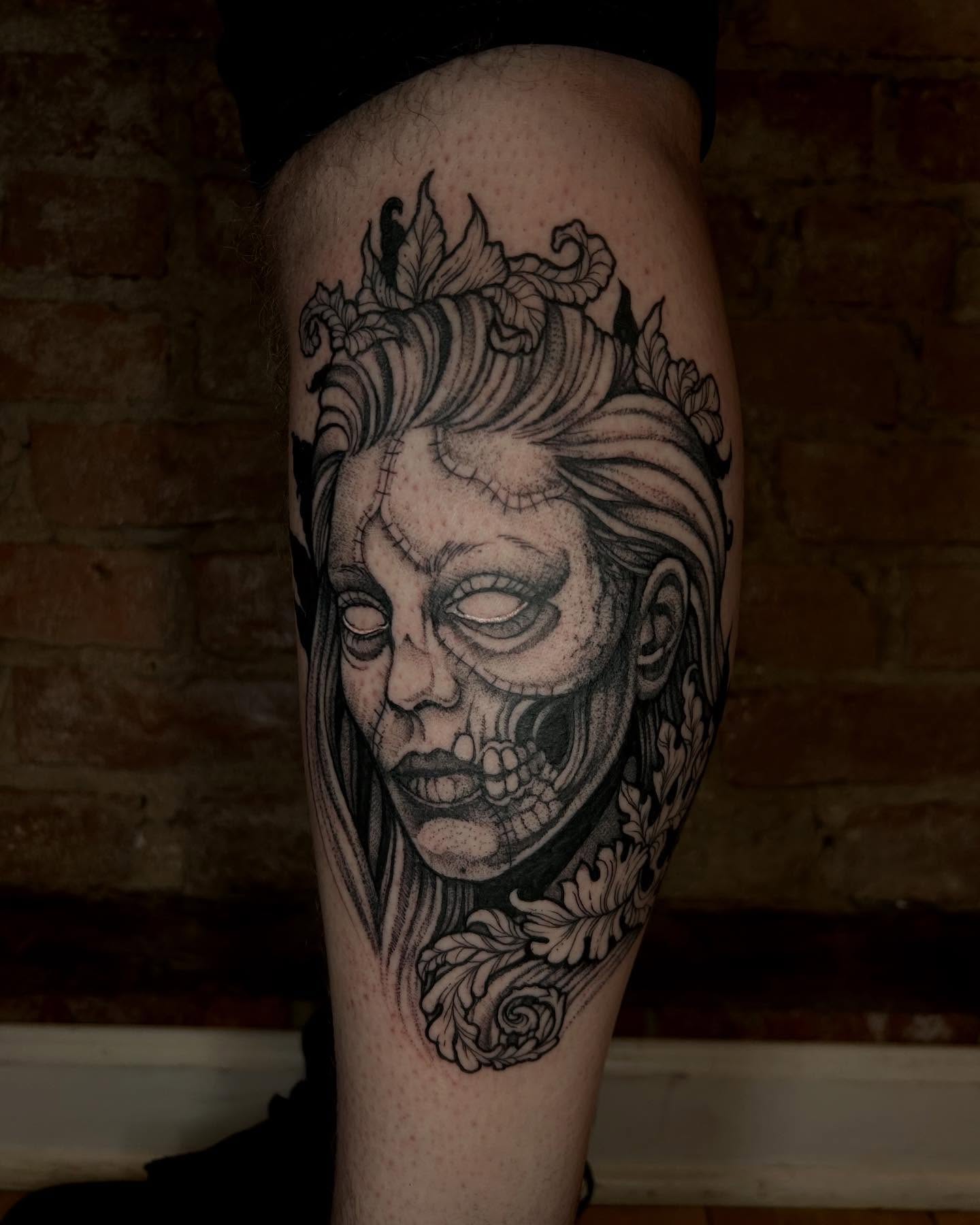 Skull with floral crown realism tattoo on the forearm by Deanna Louise