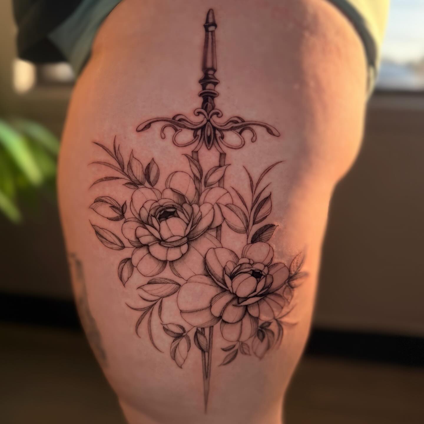 Sword and flowers ornamental tattoo on the thigh by ❀ Moo, Mount Laurel, New Jersey