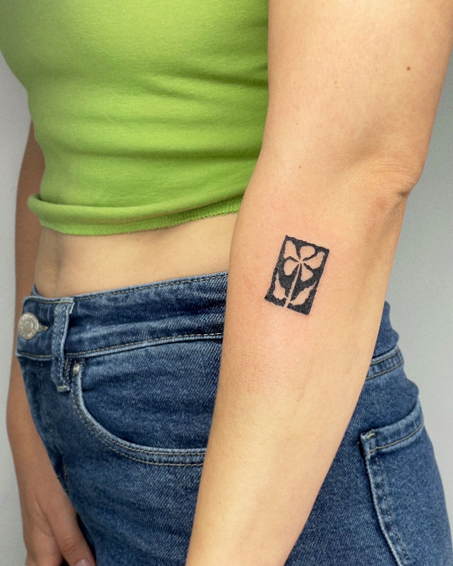 Cross geometric tattoo on the forearm by Eden Kalif