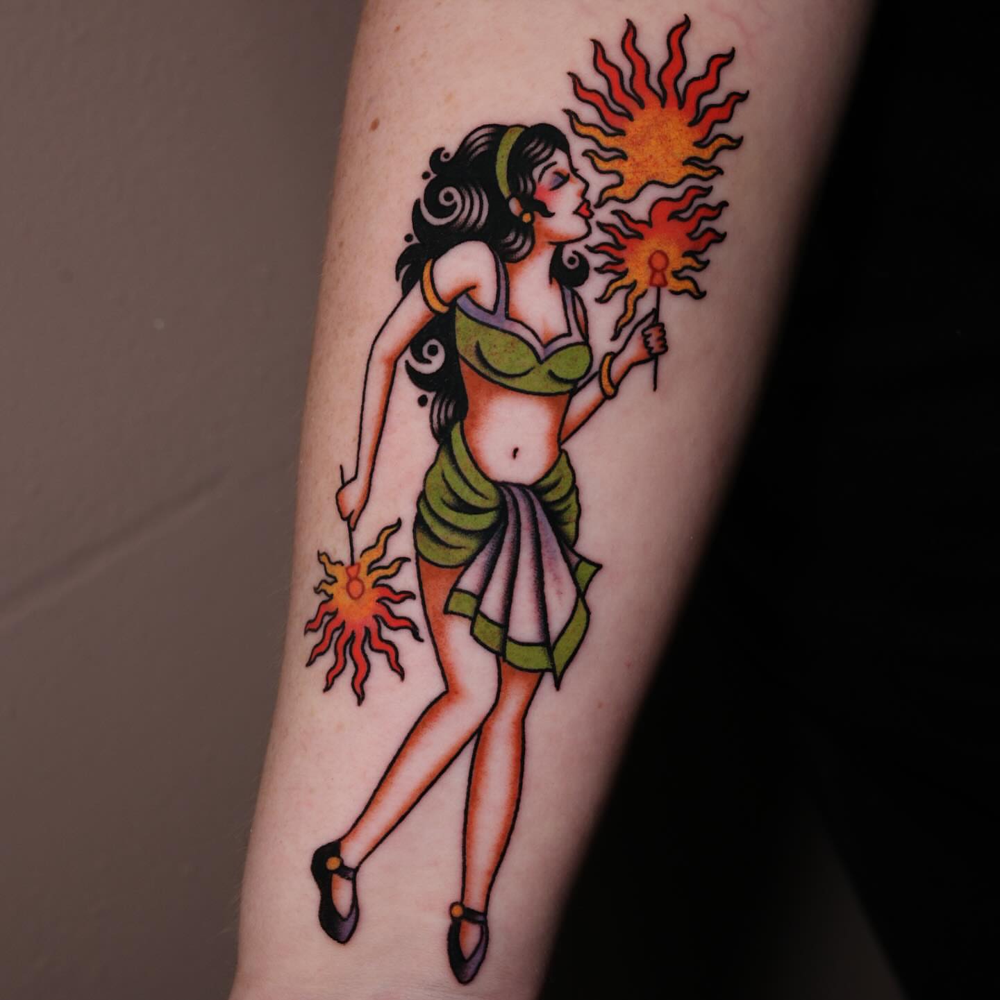 Hula dancer American traditional tattoo on the forearm by Nova Vaughn