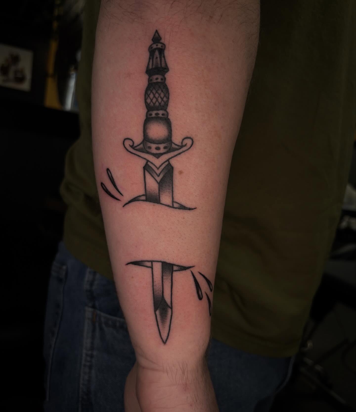Sword dotwork tattoo on the forearm by Brett Ferguson