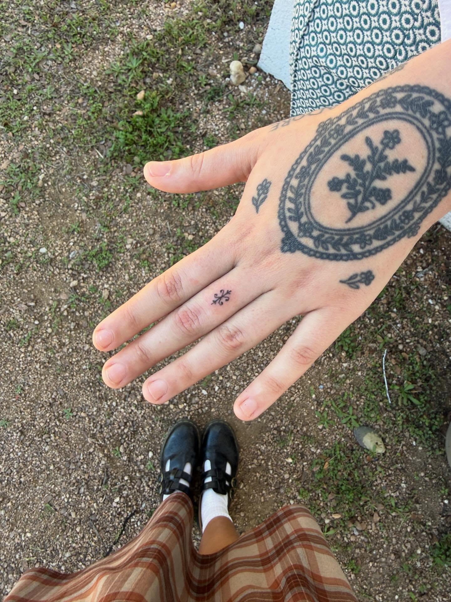 Floral wreath black and grey tattoo on the hand by springgreens