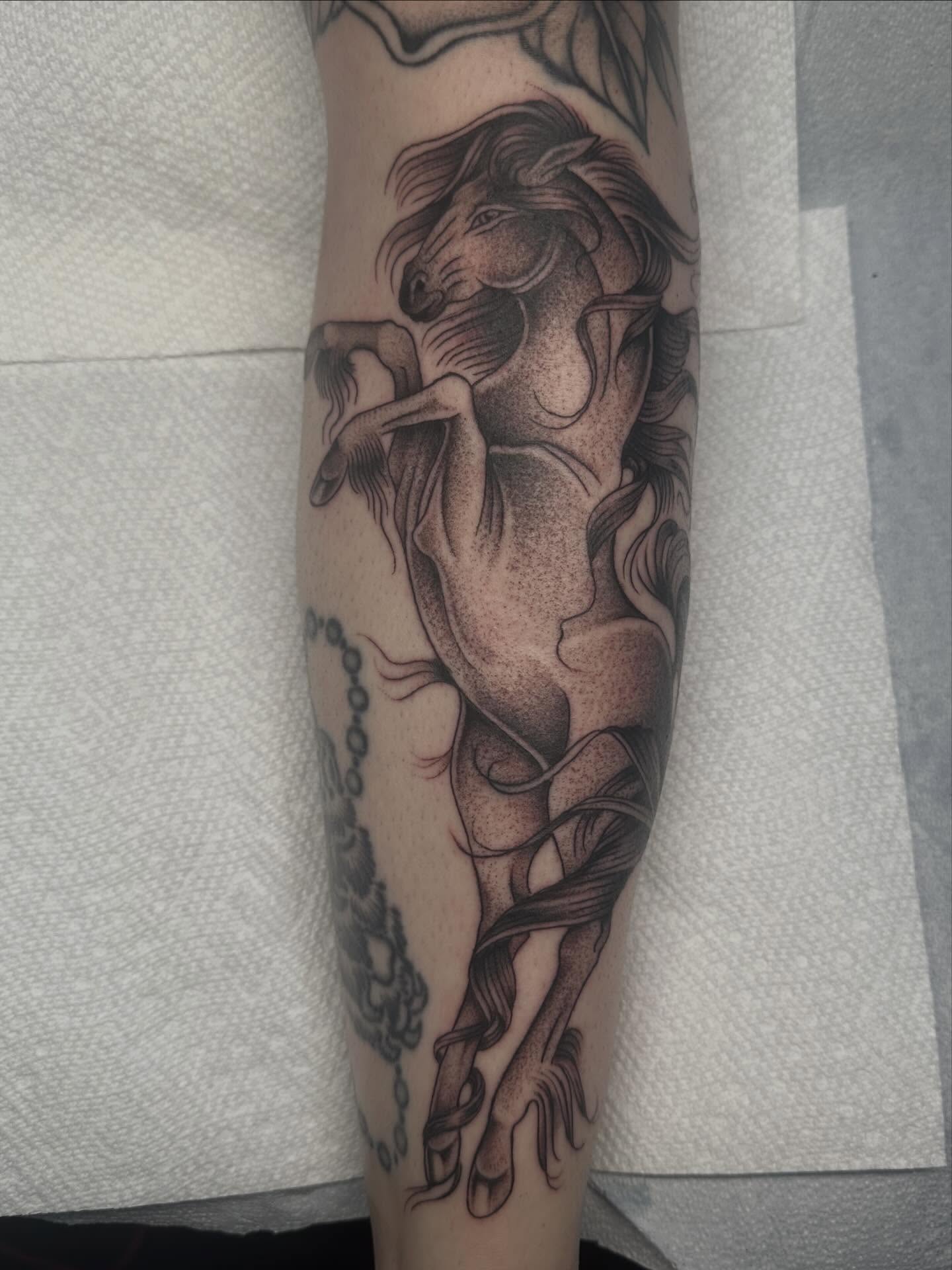 Horse rearing dotwork tattoo on the forearm by Lia Massari