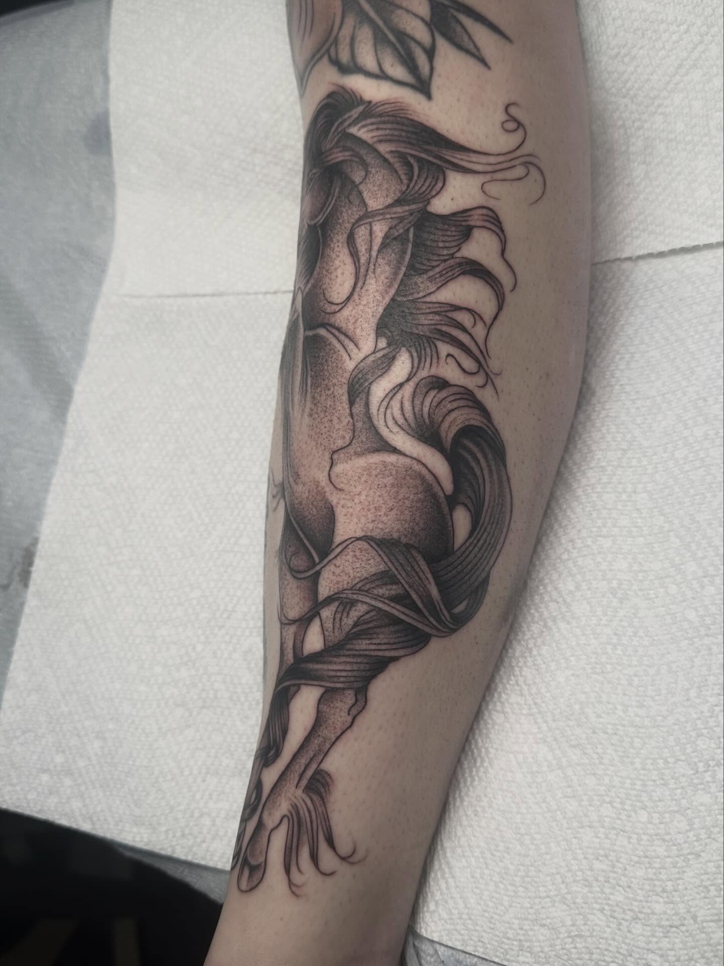 Mermaid dotwork tattoo on the forearm by Lia Massari