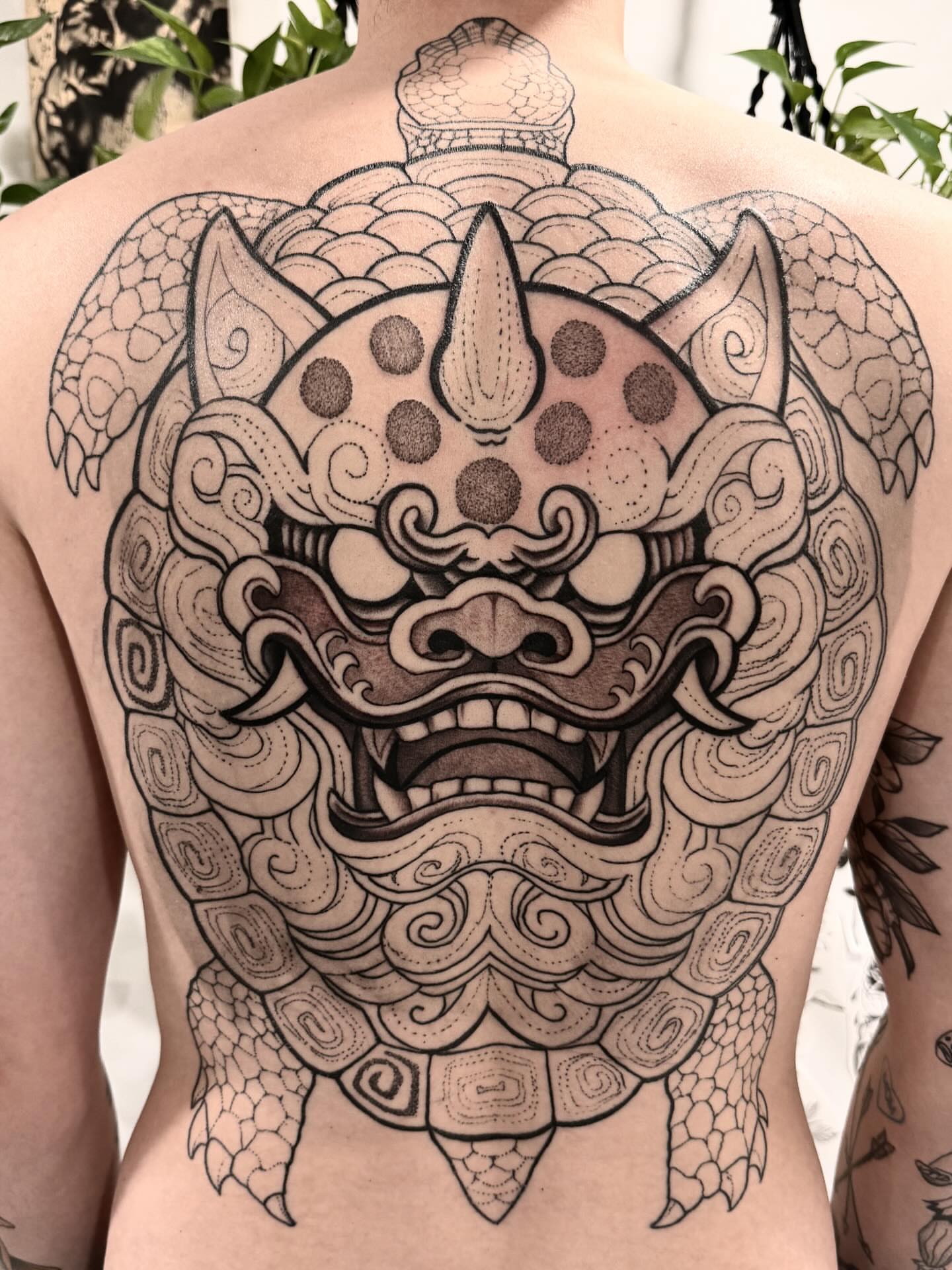 Lion mask dotwork tattoo by Shannon Misitano