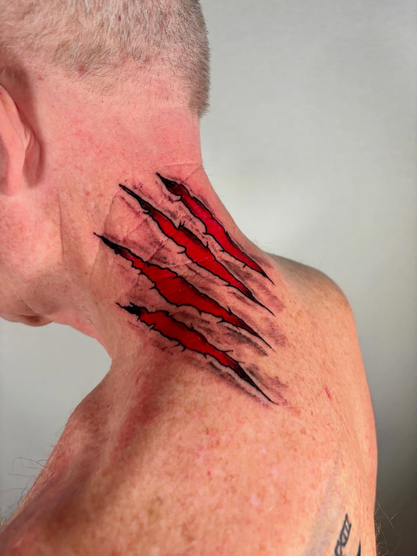 Claw marks realism tattoo on the neck by Davie Tattoos