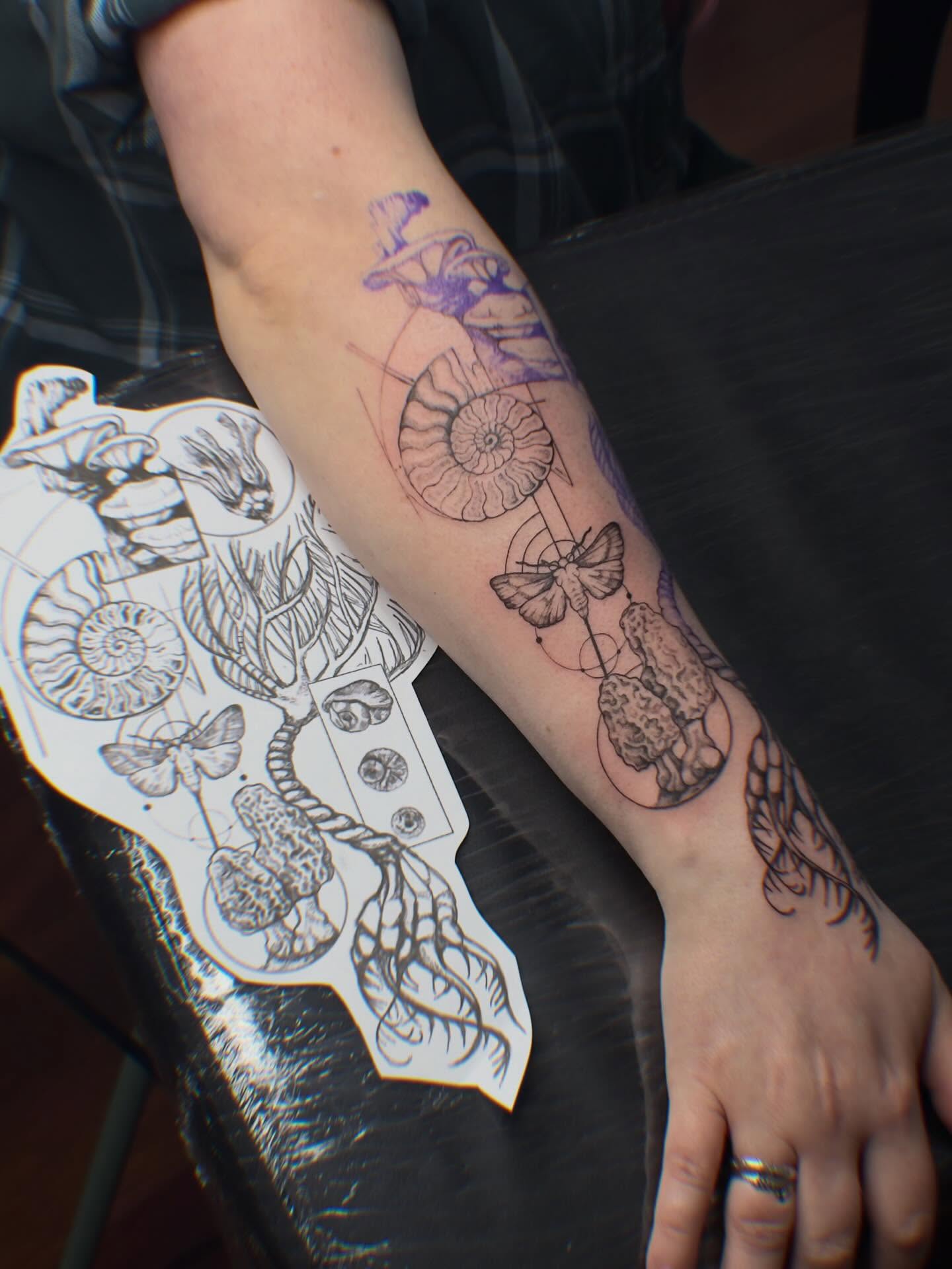 Ammonite and butterfly geometric tattoo on the forearm by ᴛᴀᴛᴛᴏᴏ ᴀʀᴛɪꜱᴛ 📍Portland, OR