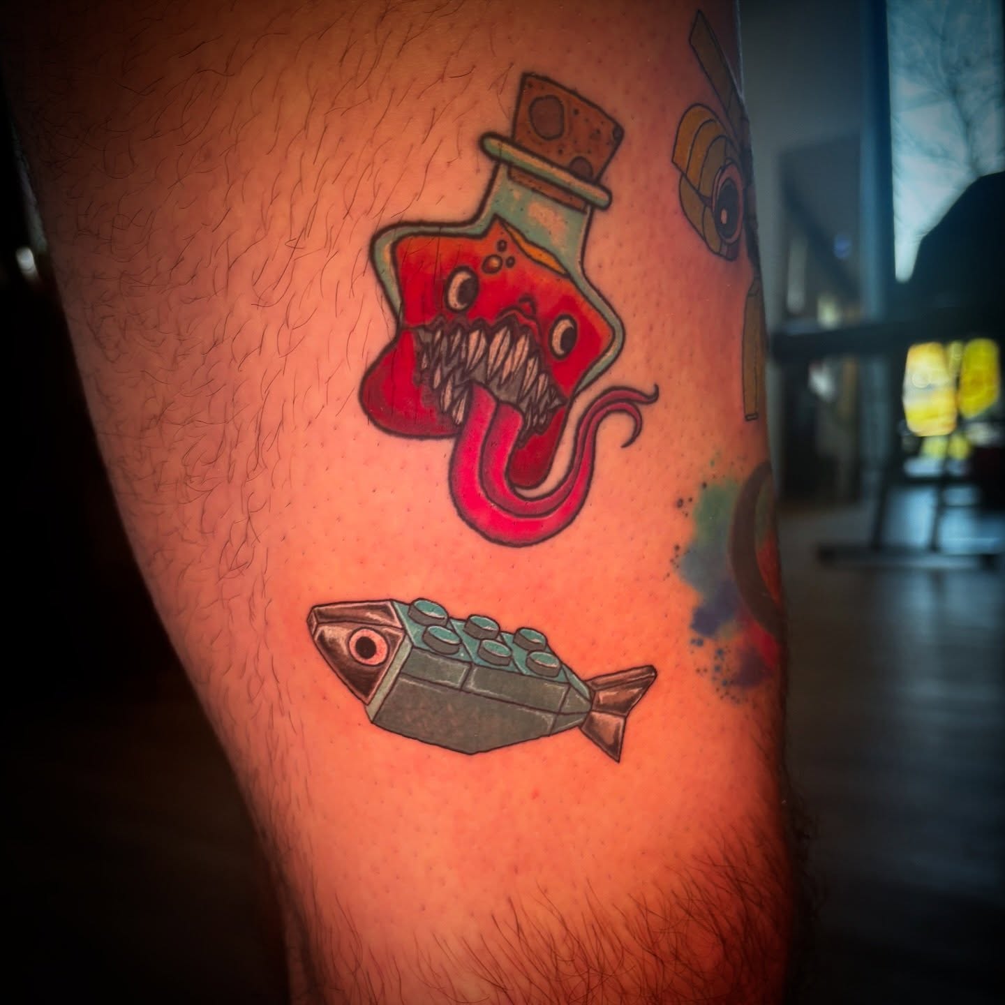 Monster bottle and fish new school tattoo on the thigh by Kiwi🌱☀️