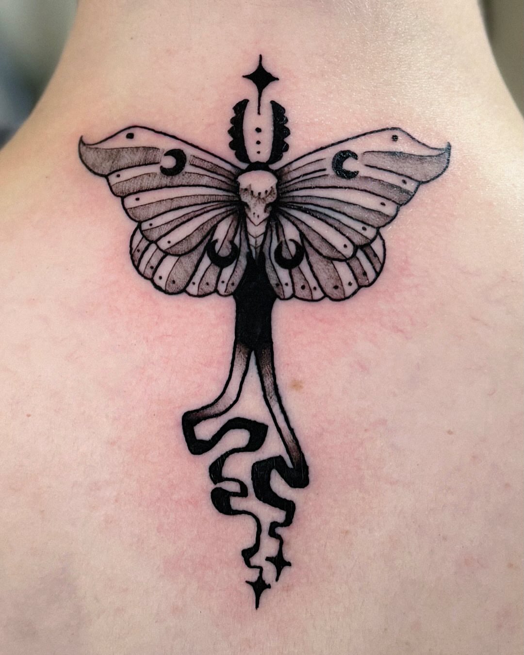 Butterfly black and grey tattoo on the back by Kal