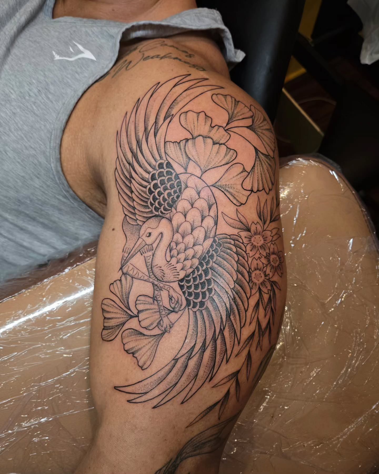 Peacock and flowers black and grey tattoo on the shoulder by jo(rdan)