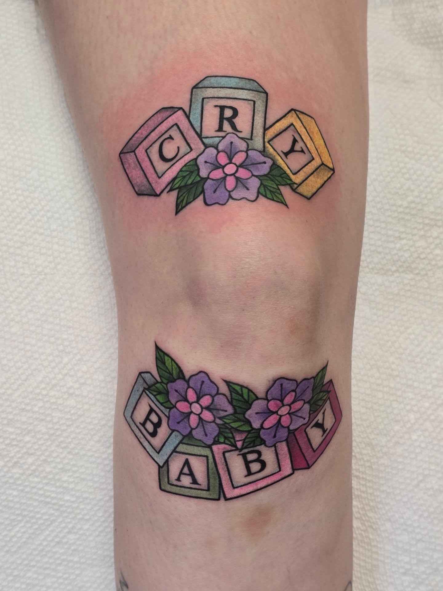 Baby blocks with flowers new school tattoo on the forearm by Rachel, Centereach, New York
