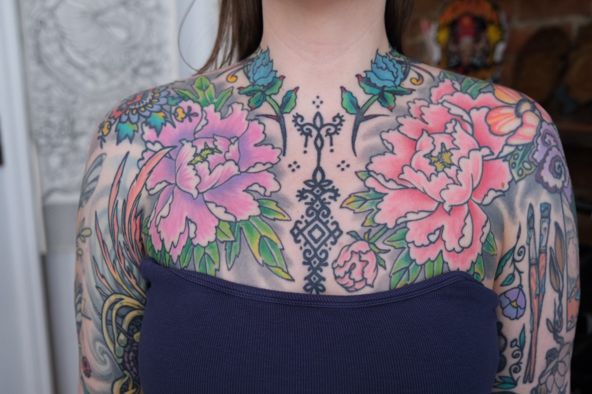 Floral arrangement American traditional tattoo on the chest by Zak Colburn