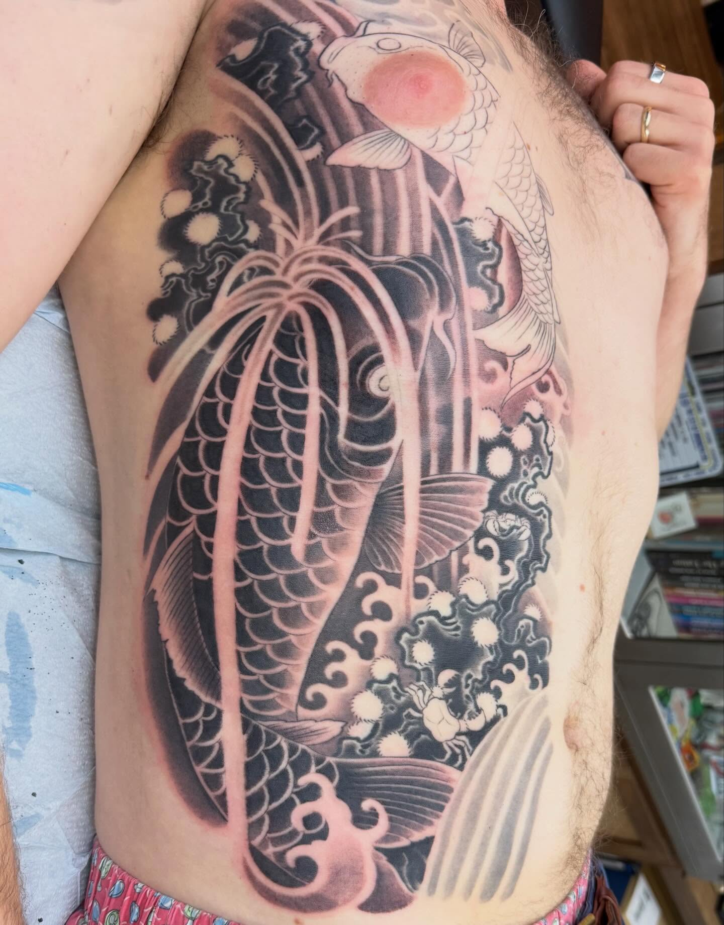 Koi fish japanese irezumi tattoo on the ribs by Hori Bensei, Charlottesville, Virginia