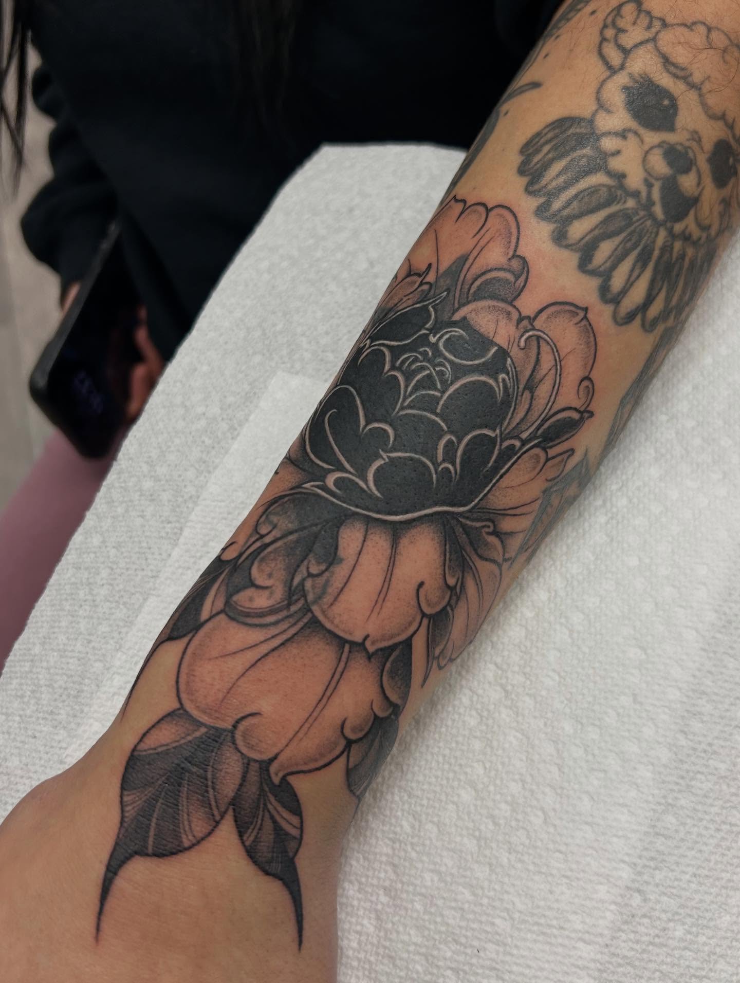Peony black and grey tattoo on the forearm by Livy baby