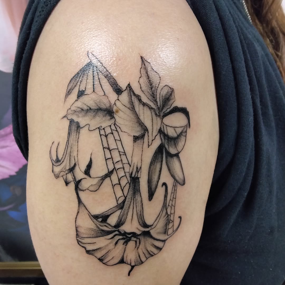 Lily black and grey tattoo on the shoulder by Malynda