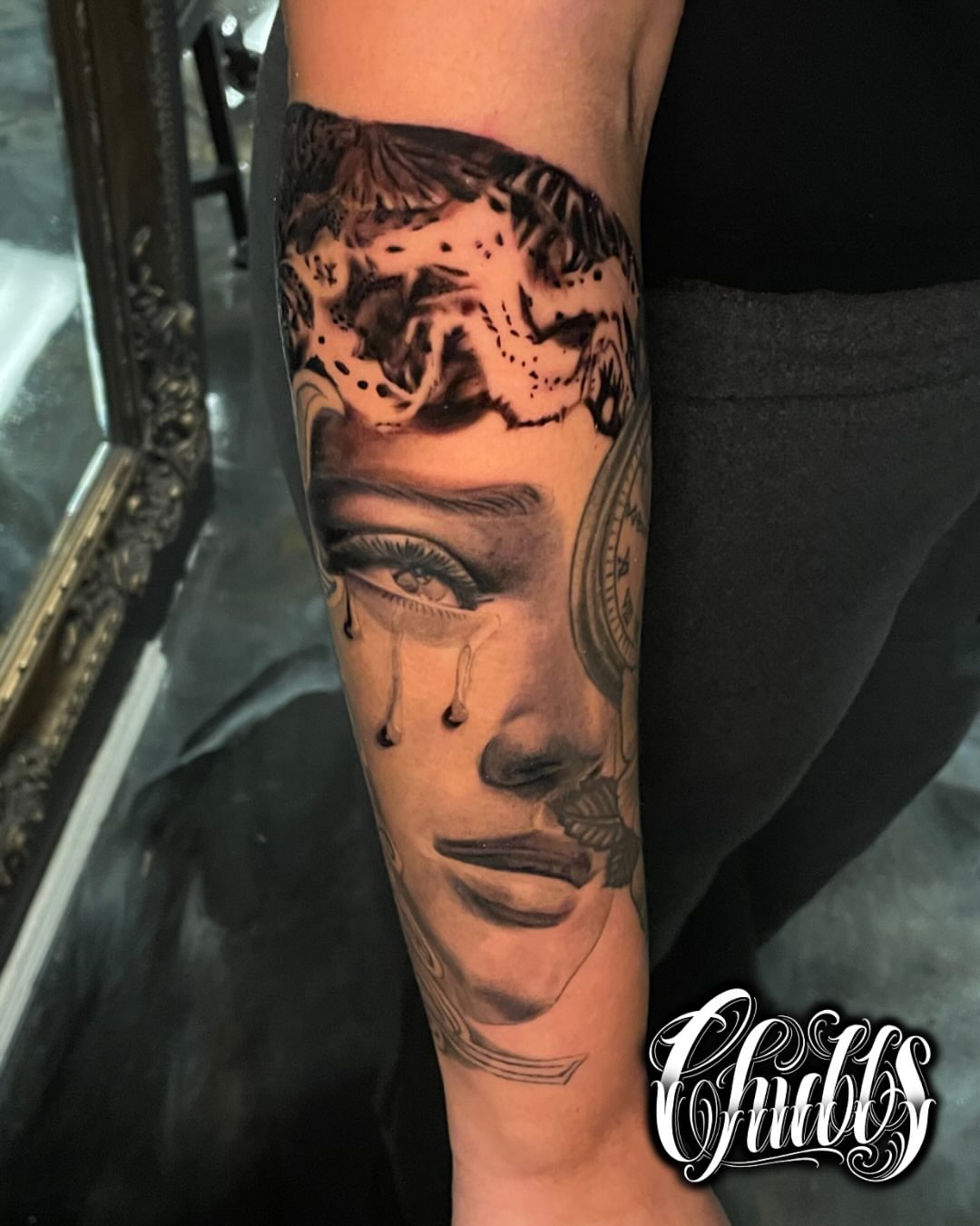 Man's face realism tattoo on the forearm by Chubbs