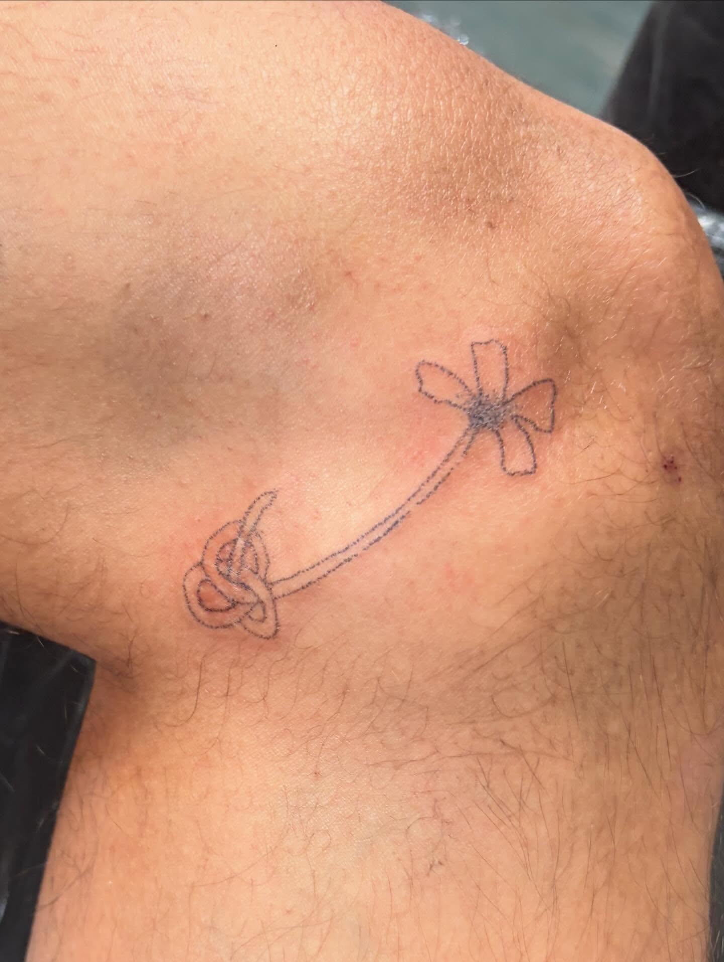 Flower with knot geometric tattoo on the shoulder by kari
